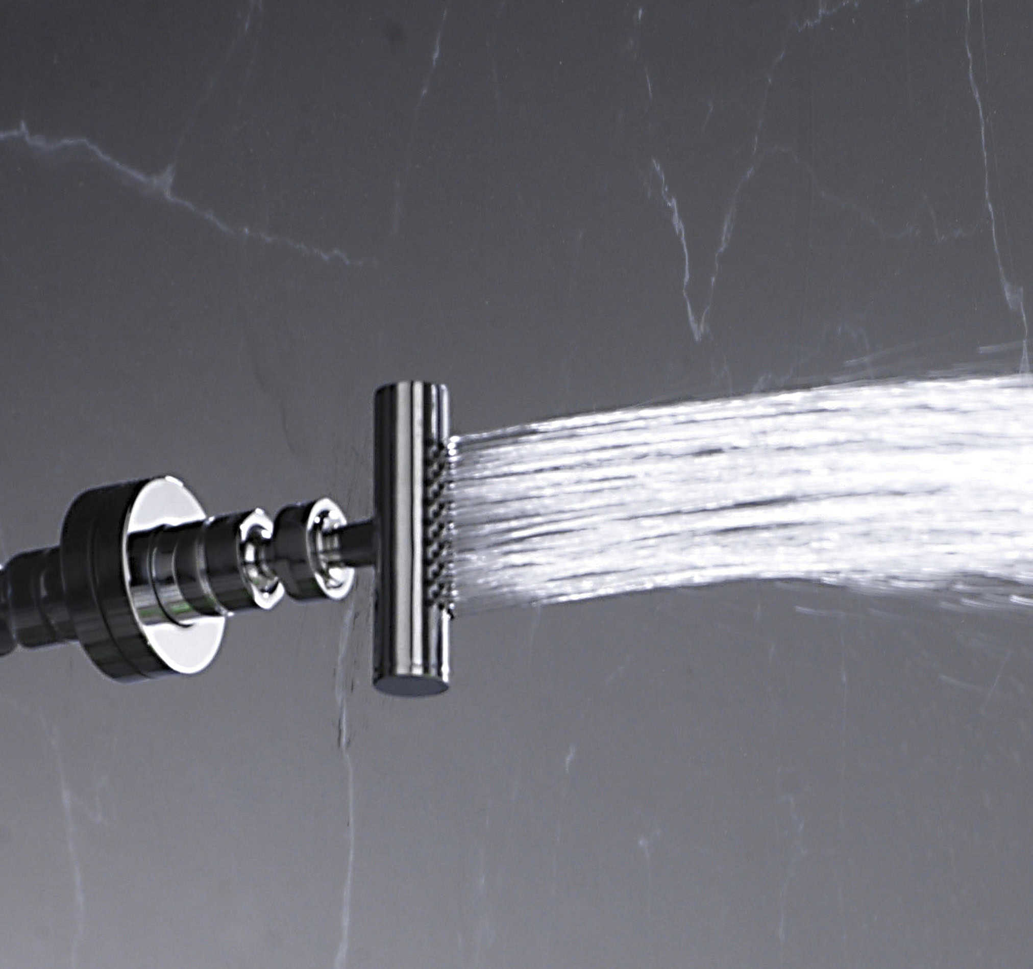 Water flowing from a high-quality bathroom shower head, showcasing modern bathroom fixtures for a luxurious shower experience.