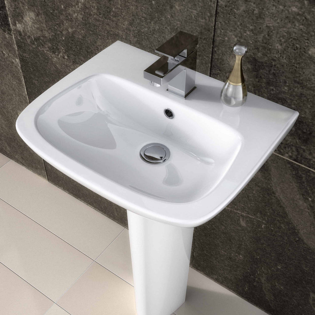 Sleek white bathroom sink with chrome faucet and modern design against textured dark wall, ideal for contemporary bathroom upgrades.
