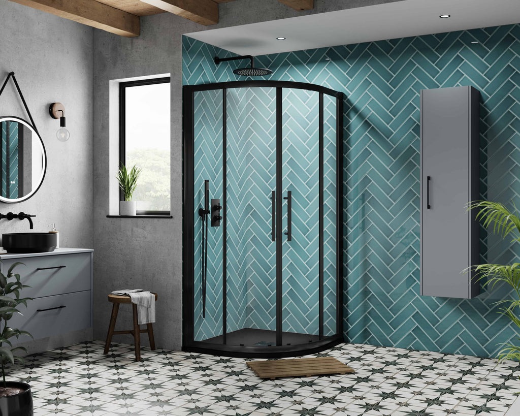 Modern corner shower enclosure with black frame on geometric patterned tile floor in stylish bathroom.