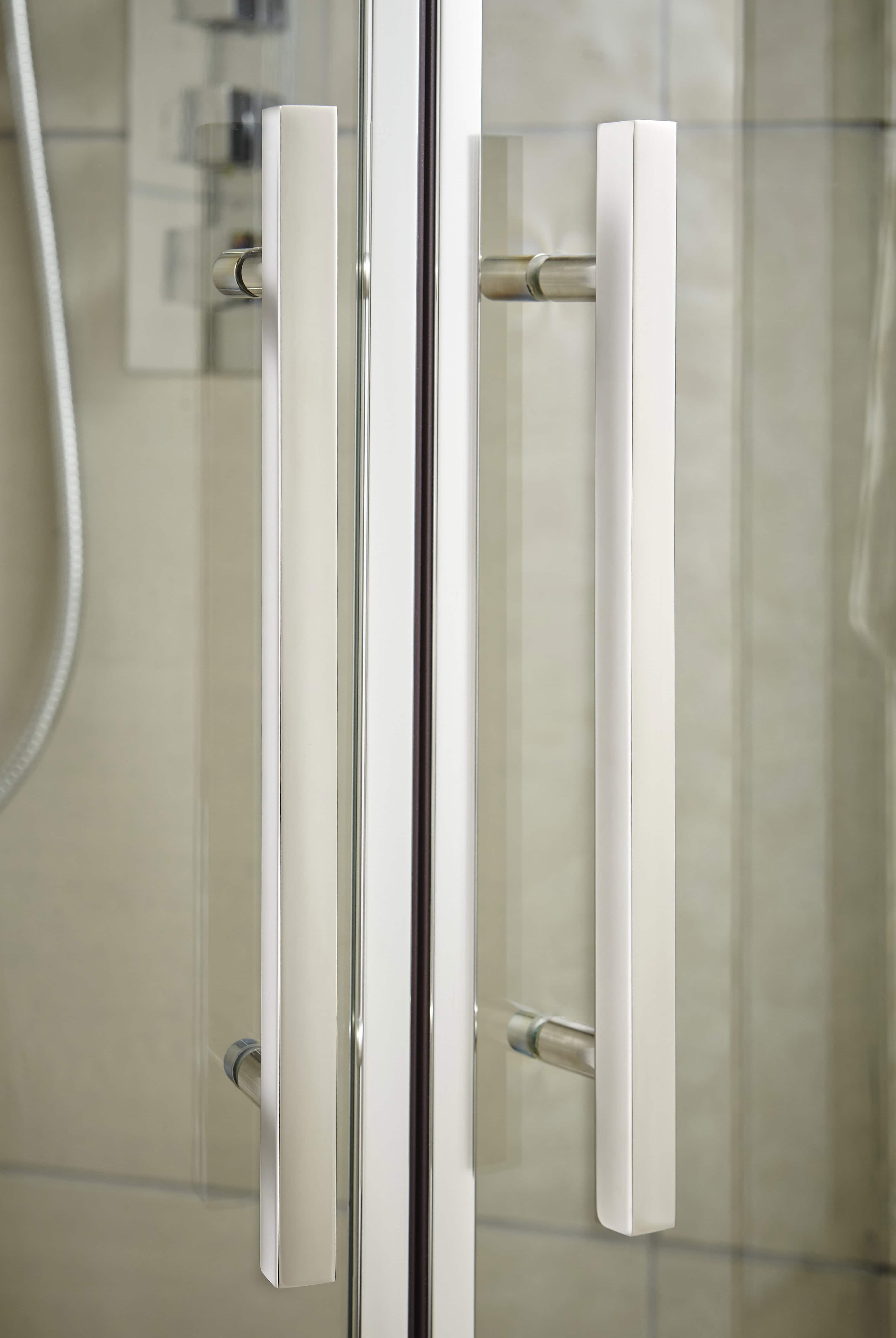 Modern glass shower door with aluminium handles, stylish bathroom design, clean aesthetic, durable shower enclosure, high-quality bathroom fixtures, tiled bathroom interior, contemporary bathroom decor, premium shower cabin, bathroom renovation, elegant shower enclosure.