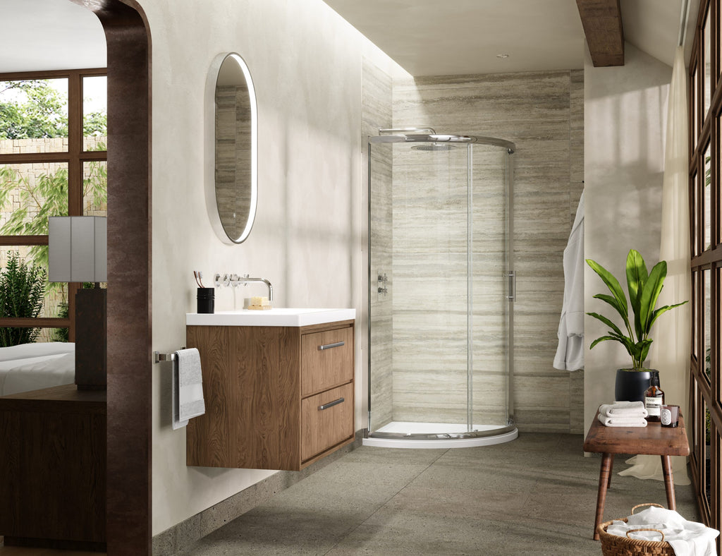 Modern bathroom with walk-in shower, wooden vanity unit, round mirror, and lush indoor plant for a stylish and relaxing space.