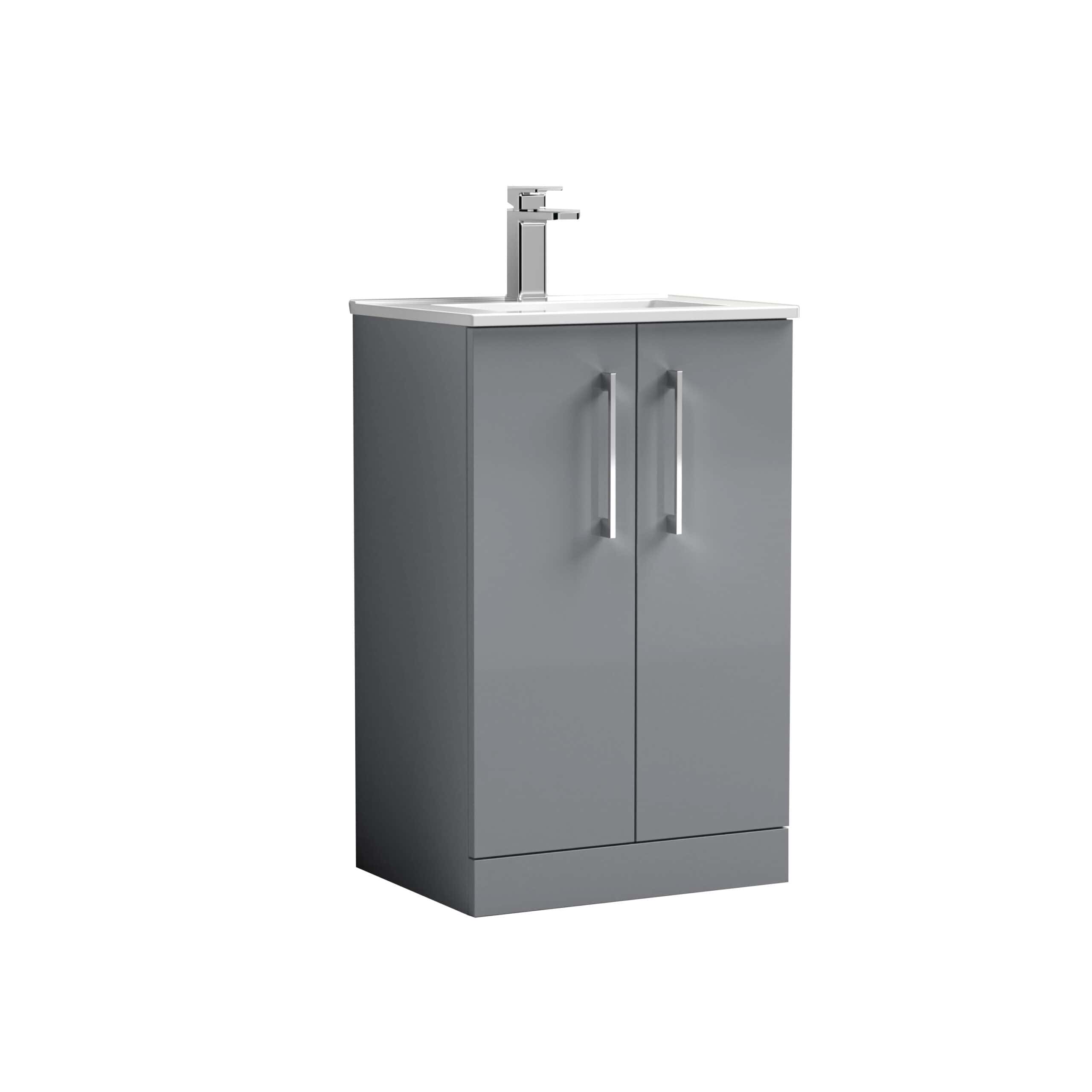 Modern grey bathroom vanity unit with integrated sink and chrome tap, ideal for contemporary bathroom décor and storage solutions.