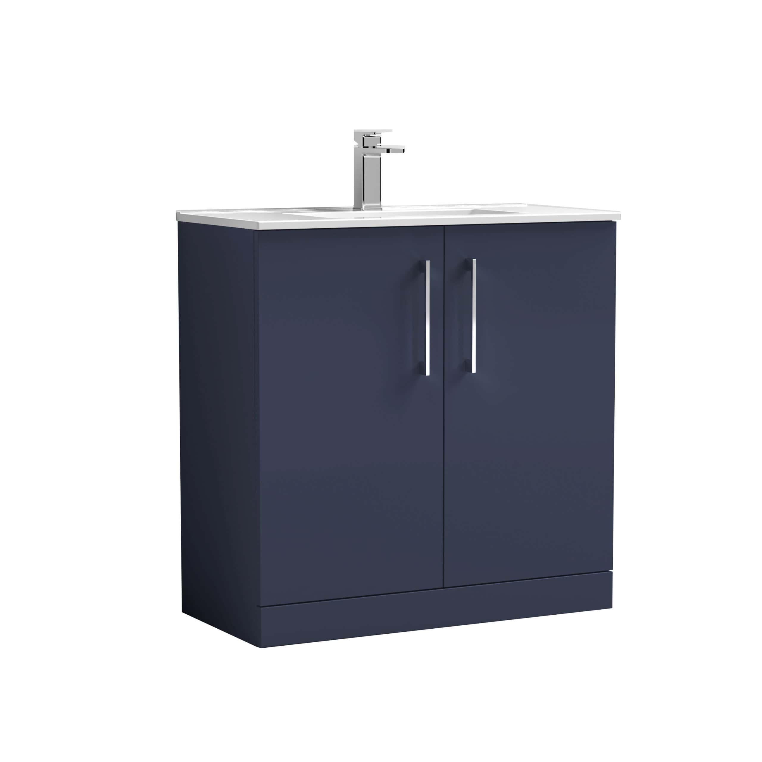 Modern navy blue bathroom vanity unit with dual cabinet doors and white countertop with integrated sink and chrome faucet, ideal for contemporary bathroom designs.