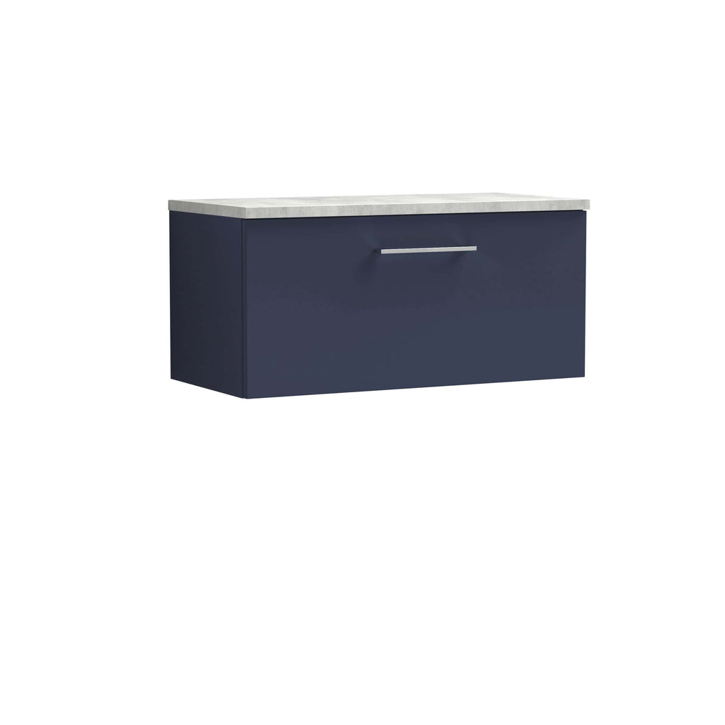 Modern navy bathroom vanity with a sleek handle and a light marble countertop for stylish bathroom storage solutions.