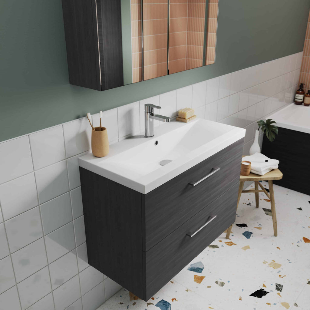 Modern bathroom vanity with sleek dark wood finish, white ceramic sink, and contemporary chrome faucet in a stylish bathroom setting.