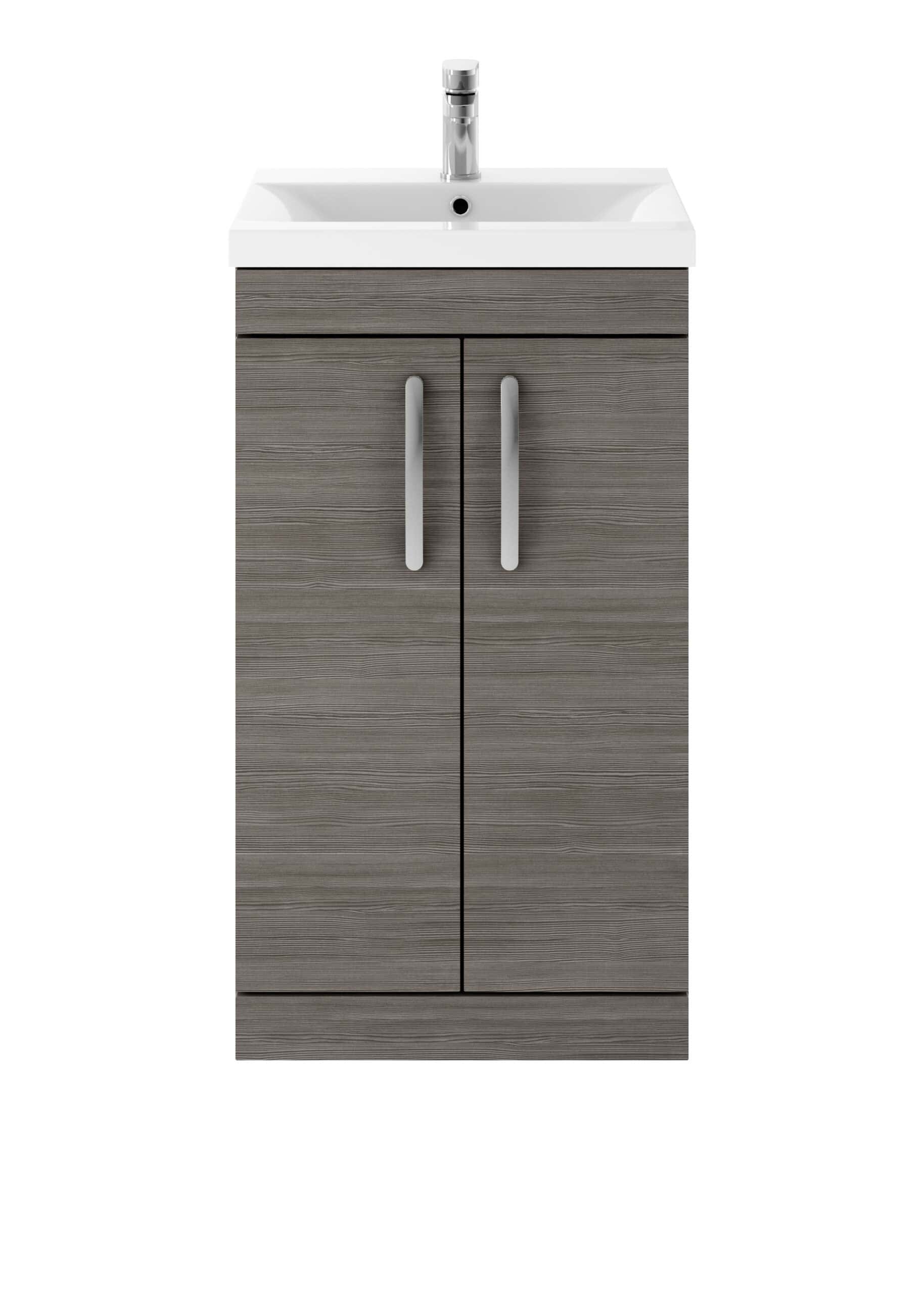 Sleek bathroom vanity with integrated sink and modern chrome tap, featuring wood-effect cabinet doors with silver handles for stylish bathroom storage.