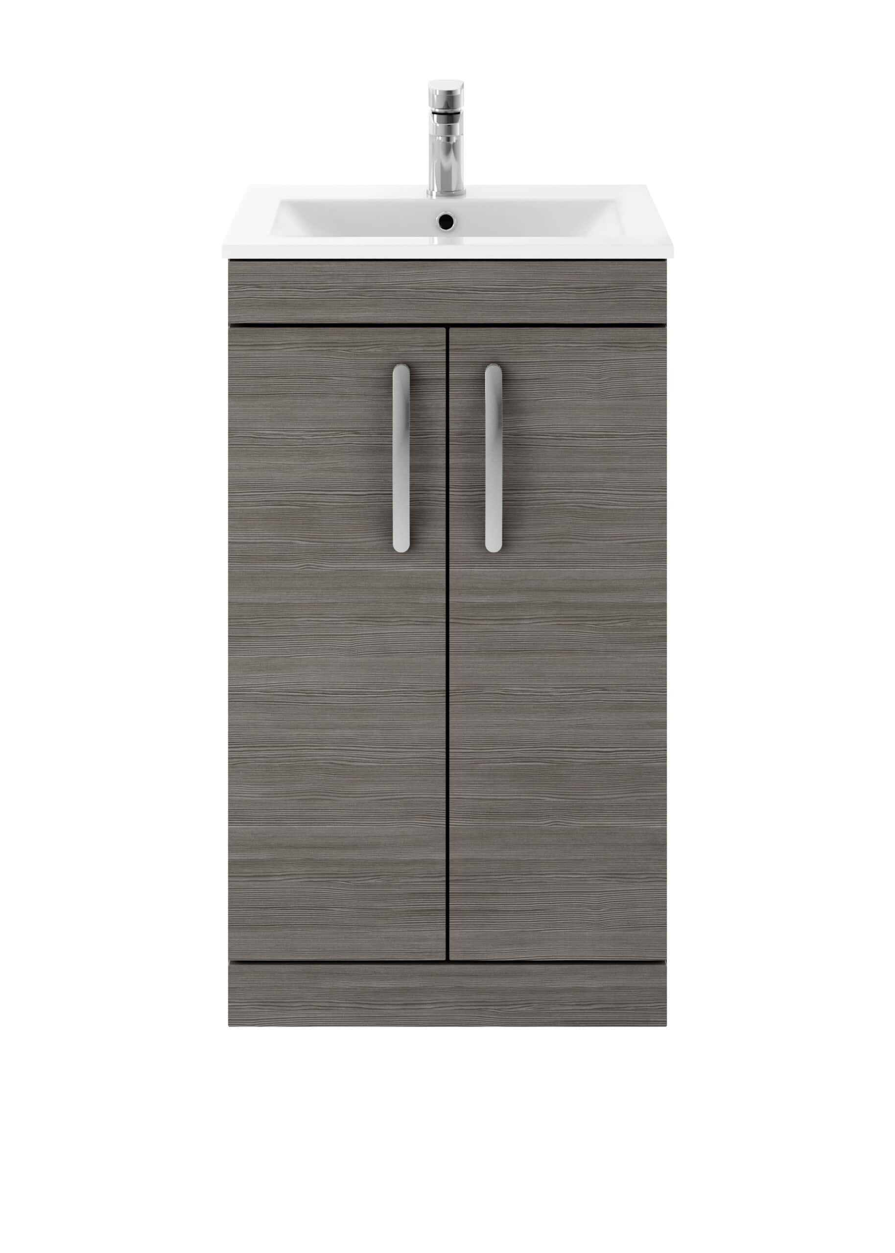Modern bathroom vanity with a sleek grey wood finish and integrated cabinet storage for bathroom essentials. Features a compact white sink and contemporary chrome handle design for a stylish bathroom upgrade.