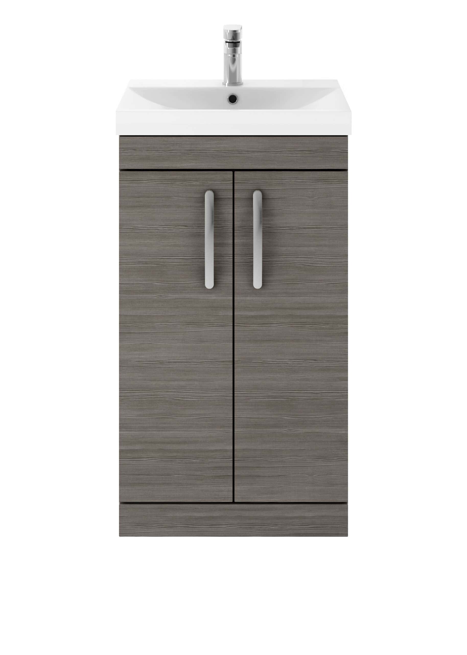 Sleek bathroom vanity unit with integrated sink in a modern grey wood finish, featuring metallic handles and top-quality fixtures for stylish and functional bathroom storage.