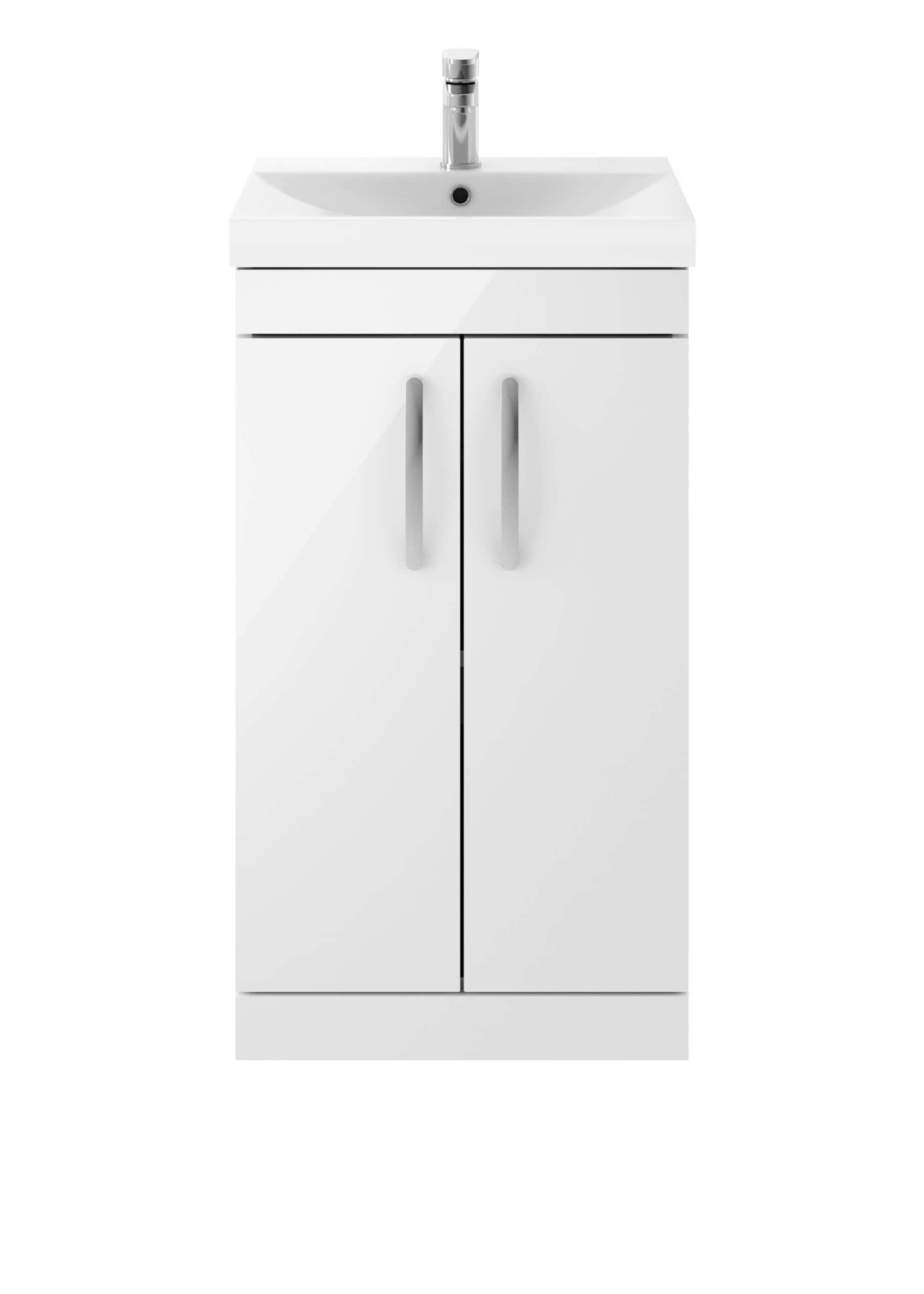Modern white bathroom vanity with a built-in sink and sleek chrome faucet.
