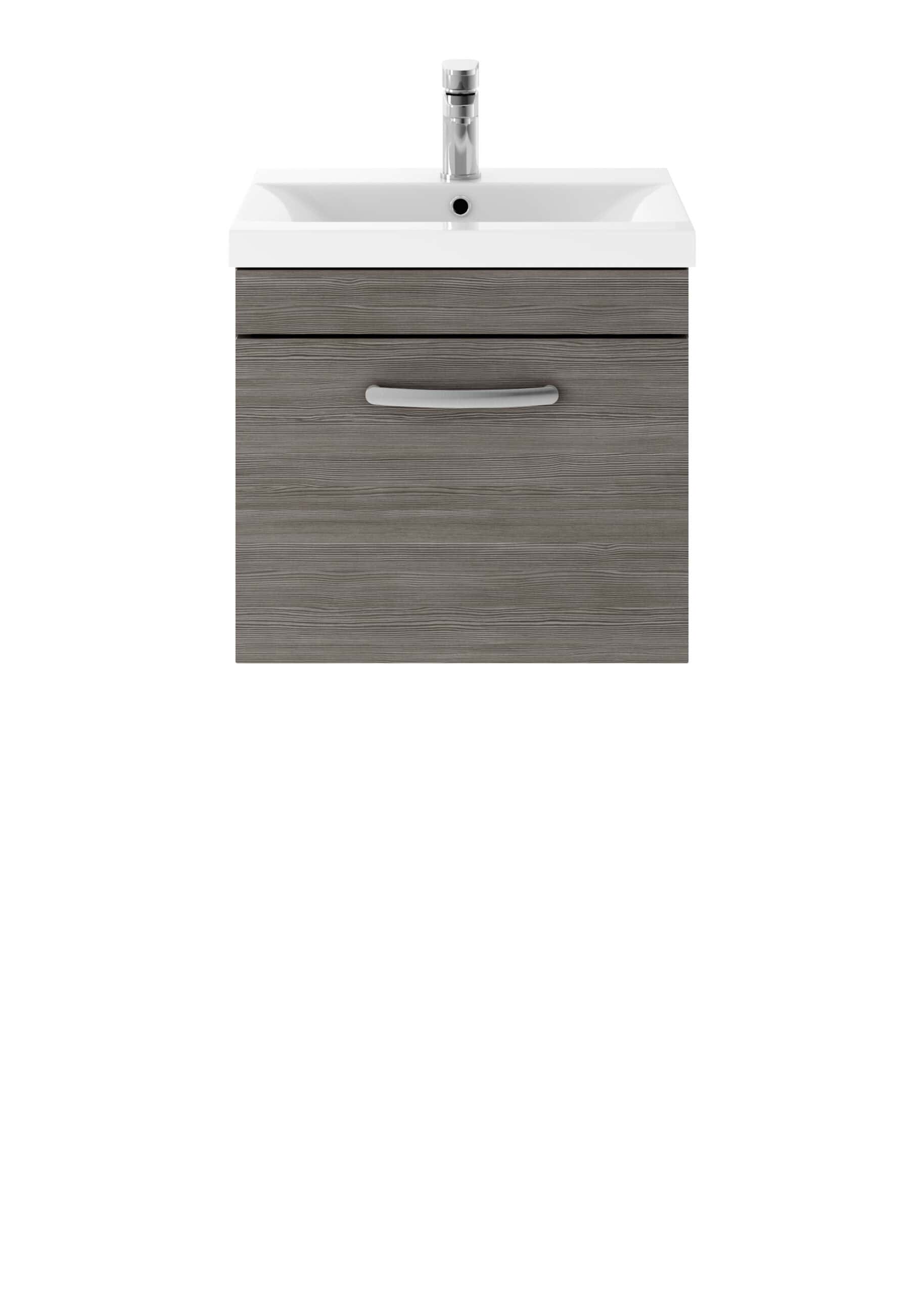 Wood effect bathroom vanity unit with integrated sink and chrome tap.