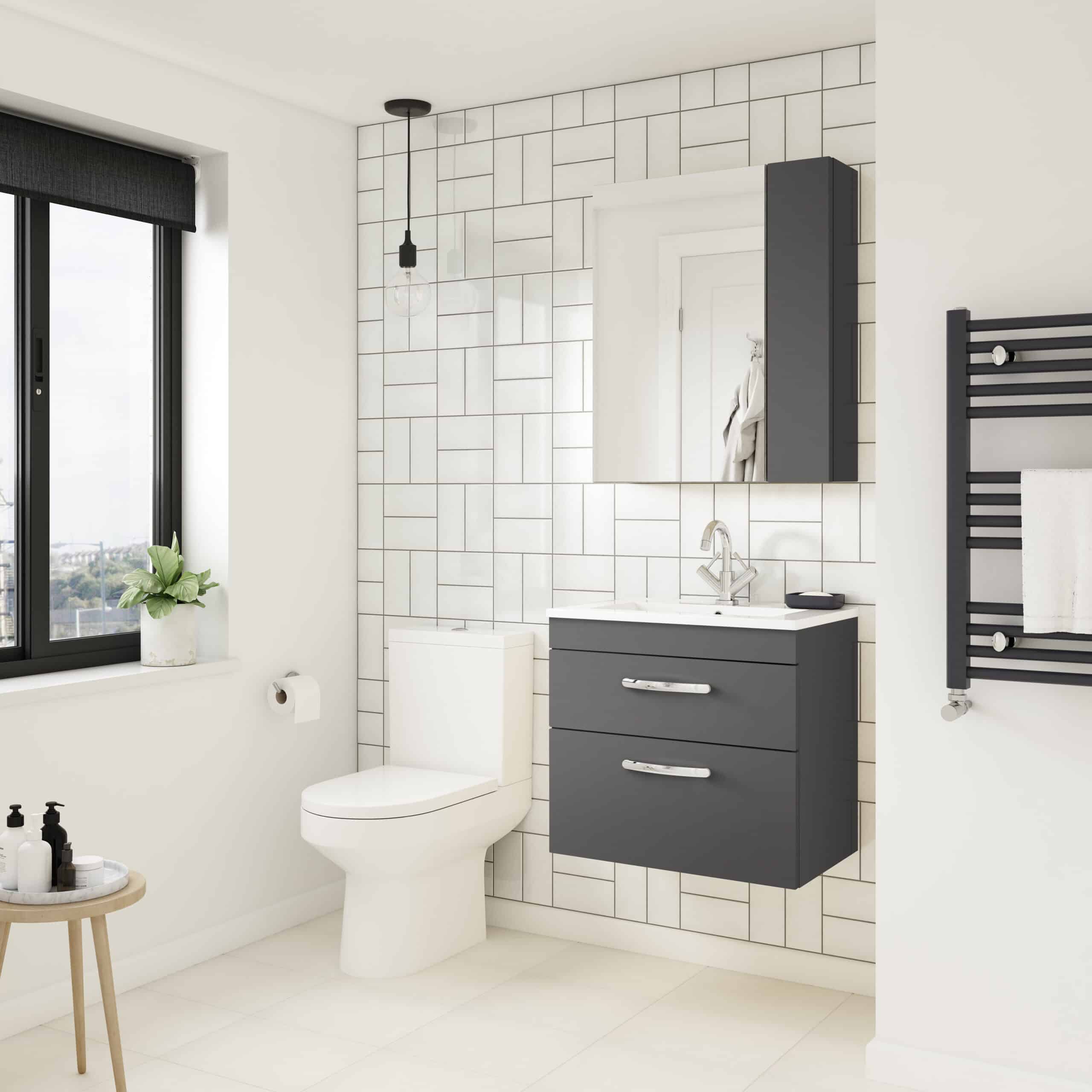 Modern minimalist bathroom with sleek black vanity, wall-mounted mirror, and towel warmer, featuring clean white tiles and ample natural light for a stylish bathroom renovation.