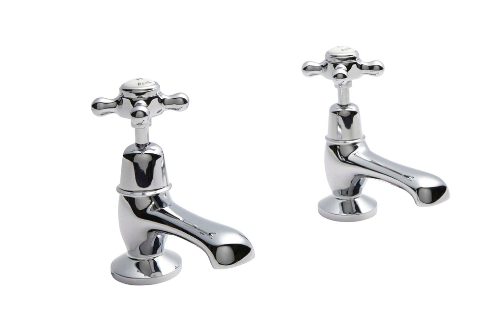 Shiny chrome bathroom sink taps with cross handles, ideal for classic bathroom interiors, high-quality plumbing fixtures from Bubly Bathrooms.