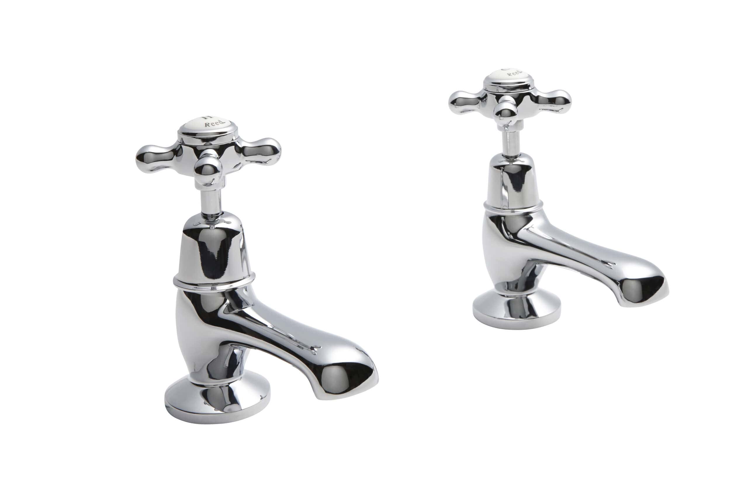 Shiny chrome bathroom sink taps with cross handles, ideal for classic bathroom interiors, high-quality plumbing fixtures from Bubly Bathrooms.