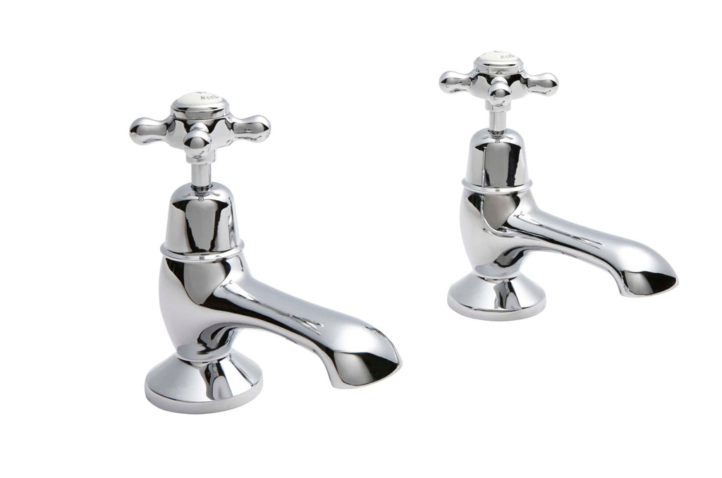 Shiny chrome bathroom taps set for classic bathroom design, featuring traditional cross handles and smooth curved spouts, ideal for updating vintage or period-style bathrooms.