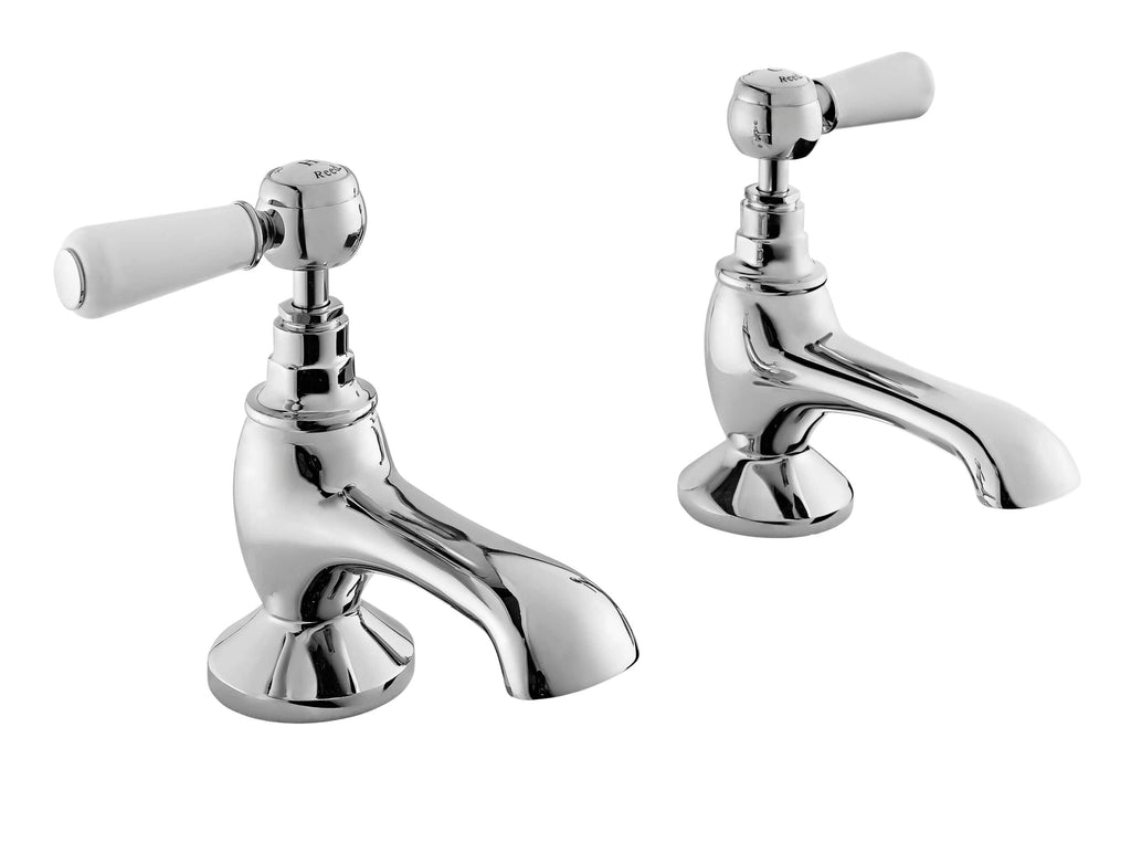 Chrome bathroom tap set with white ceramic handles, vintage style for classic bathroom decor. Suitable for washbasins or sinks, durable and easy to install.