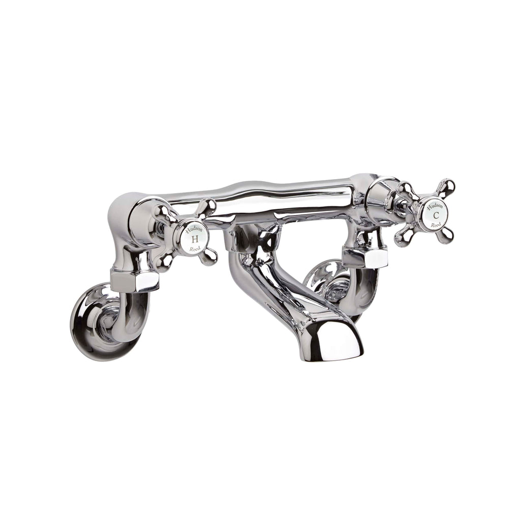 Polished chrome vintage-style double handle bathroom tap with cross-shaped levers. Ideal for classic bathroom or basin sinks, combining timeless design with high-quality materials.