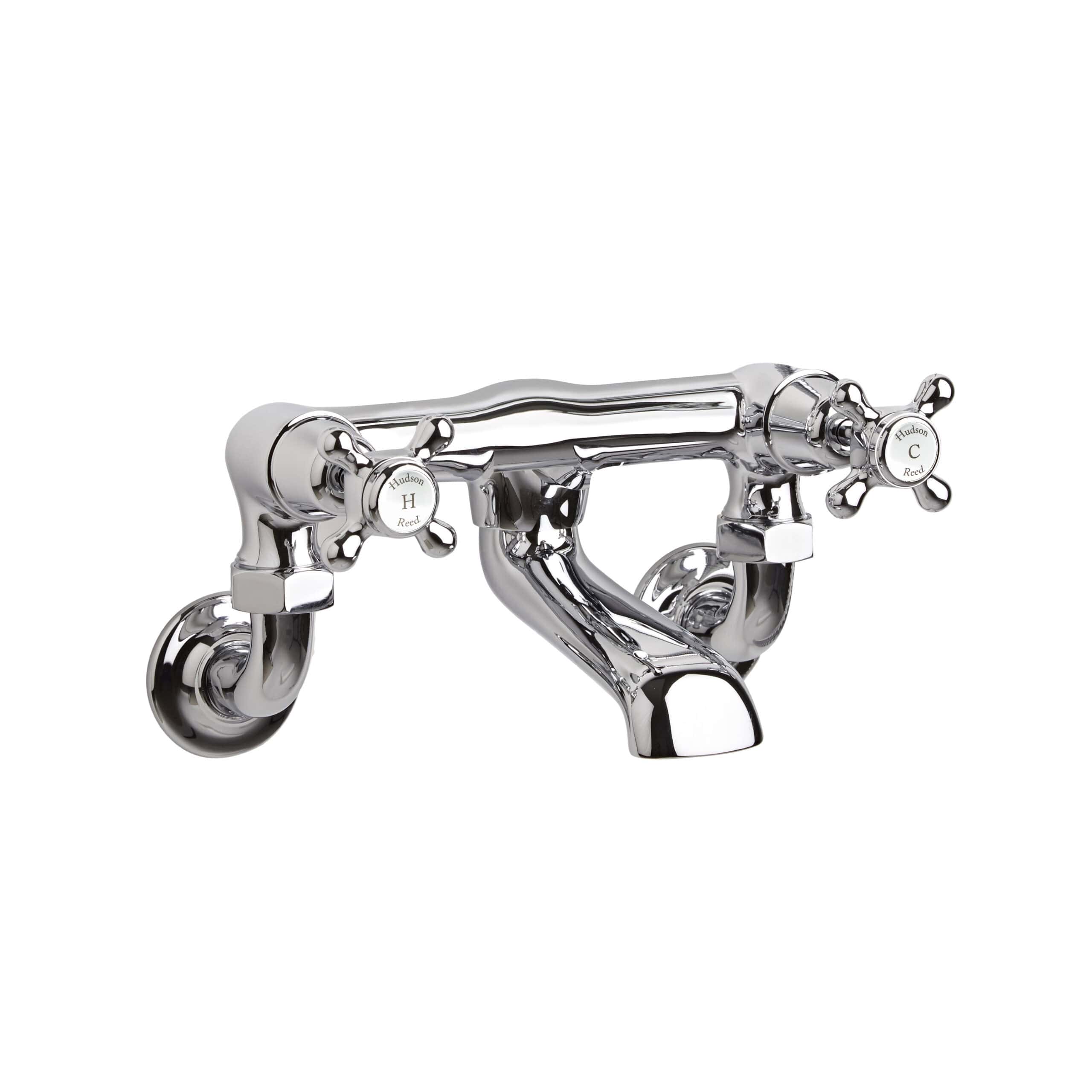 Polished chrome vintage-style double handle bathroom tap with cross-shaped levers. Ideal for classic bathroom or basin sinks, combining timeless design with high-quality materials.