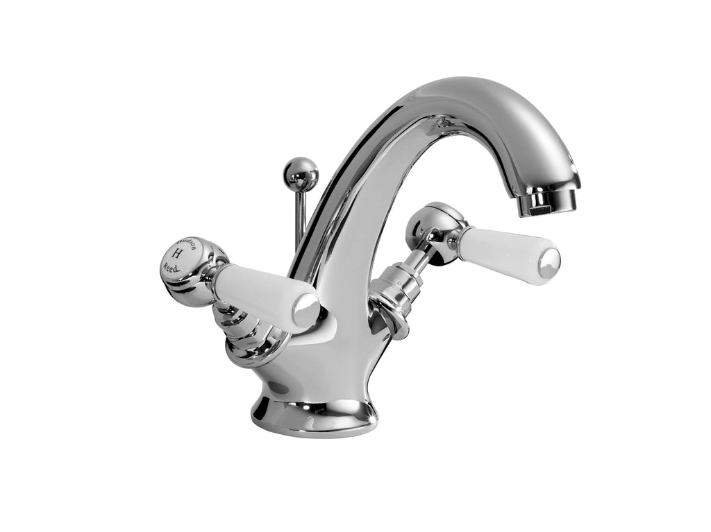 Chrome bathroom tap with white ceramic handles, modern and stylish design for contemporary bathrooms. Perfect for kitchen sinks and washbasins, durable and easy to operate.