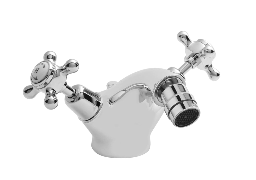 Polished chrome bathroom sink tap with dual cross handles, vintage-style mixer for hot and cold water, suitable for traditional or modern bathroom designs.