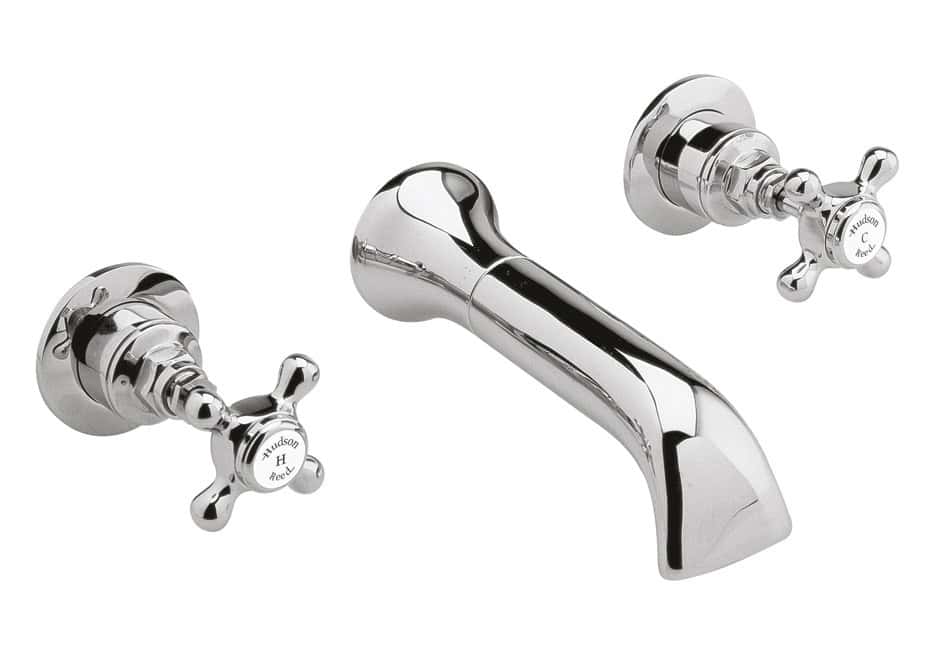 Polished chrome bathroom sink tap with cross handles for traditional bathroom design.