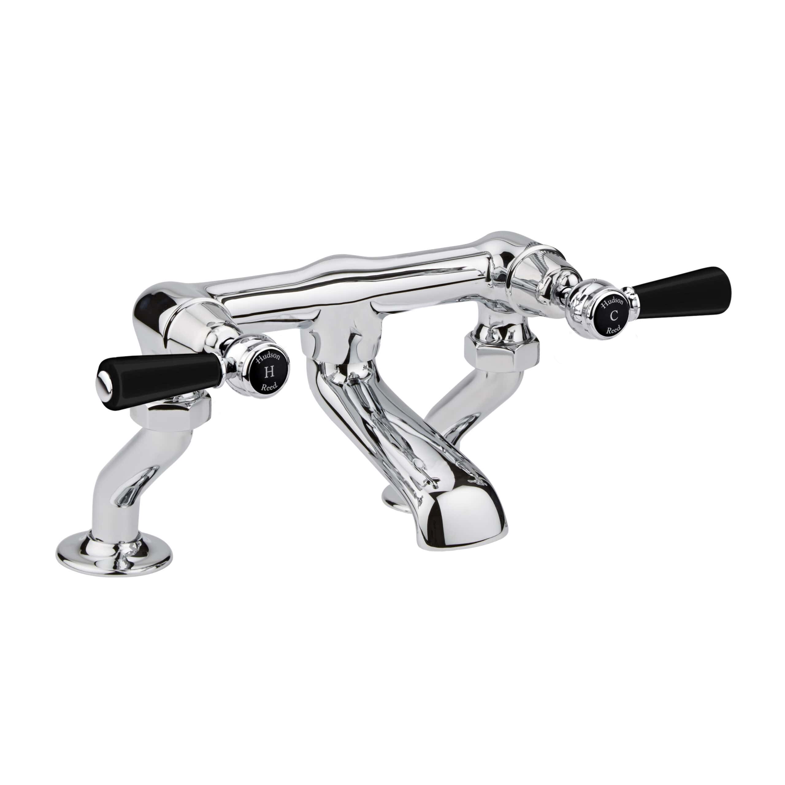 Polished chrome vintage style bathroom tap with black handles, traditional design, ideal for classic bathroom décor and high-quality plumbing fixtures.