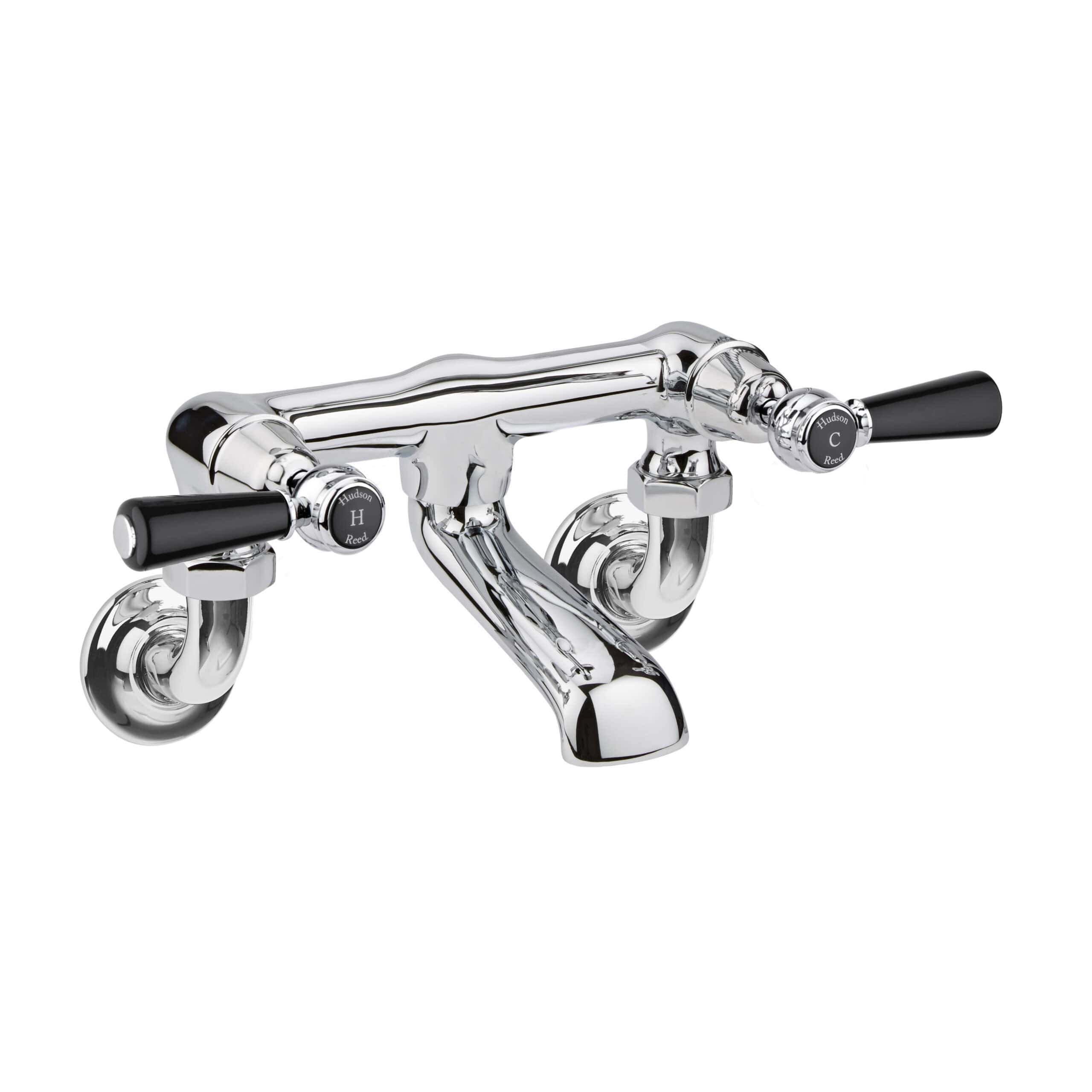 Polished chrome vintage bathroom tap with black handles, ideal for classic bathroom renovation projects, providing elegant and functional water control.