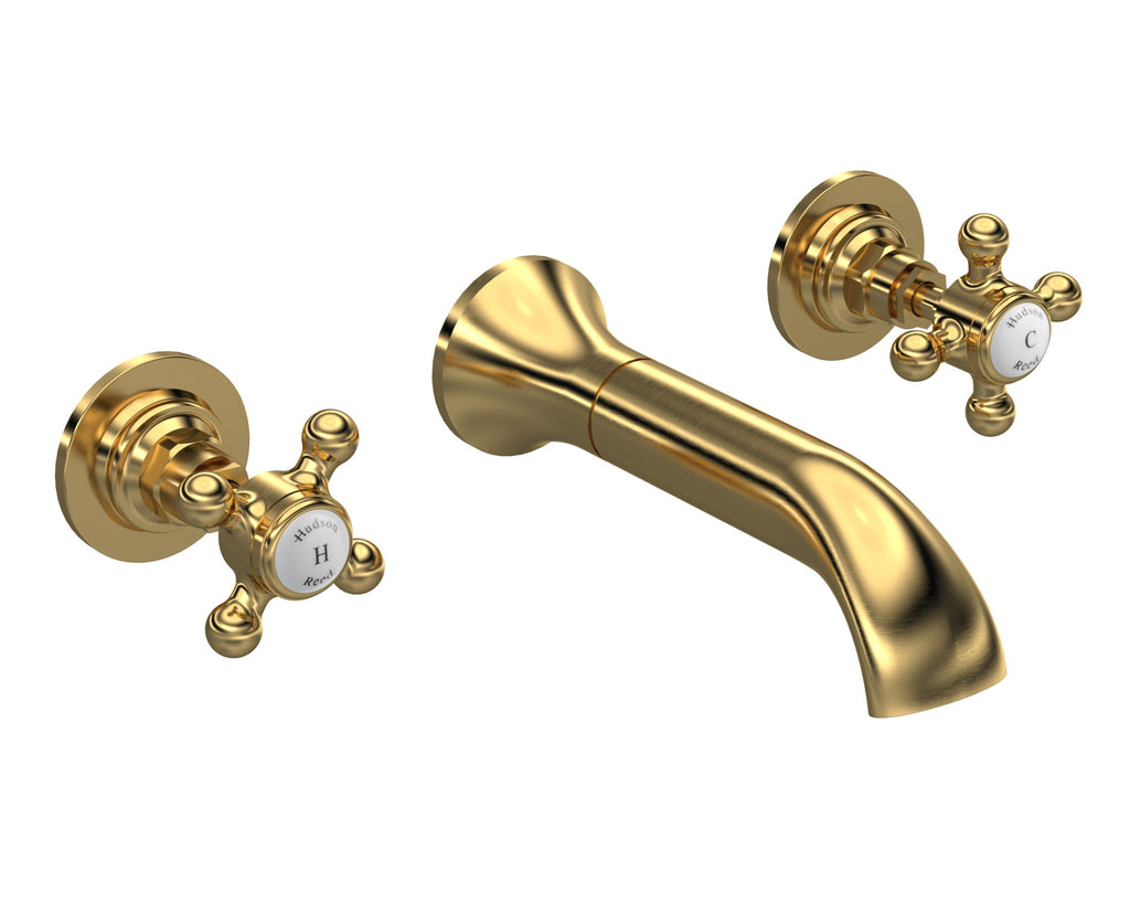 Golden brass bathroom tap with two cross handles, vintage style, high-quality plumbing fixture, perfect for luxury bathroom redesigns, branded with Hudson Reed logo.