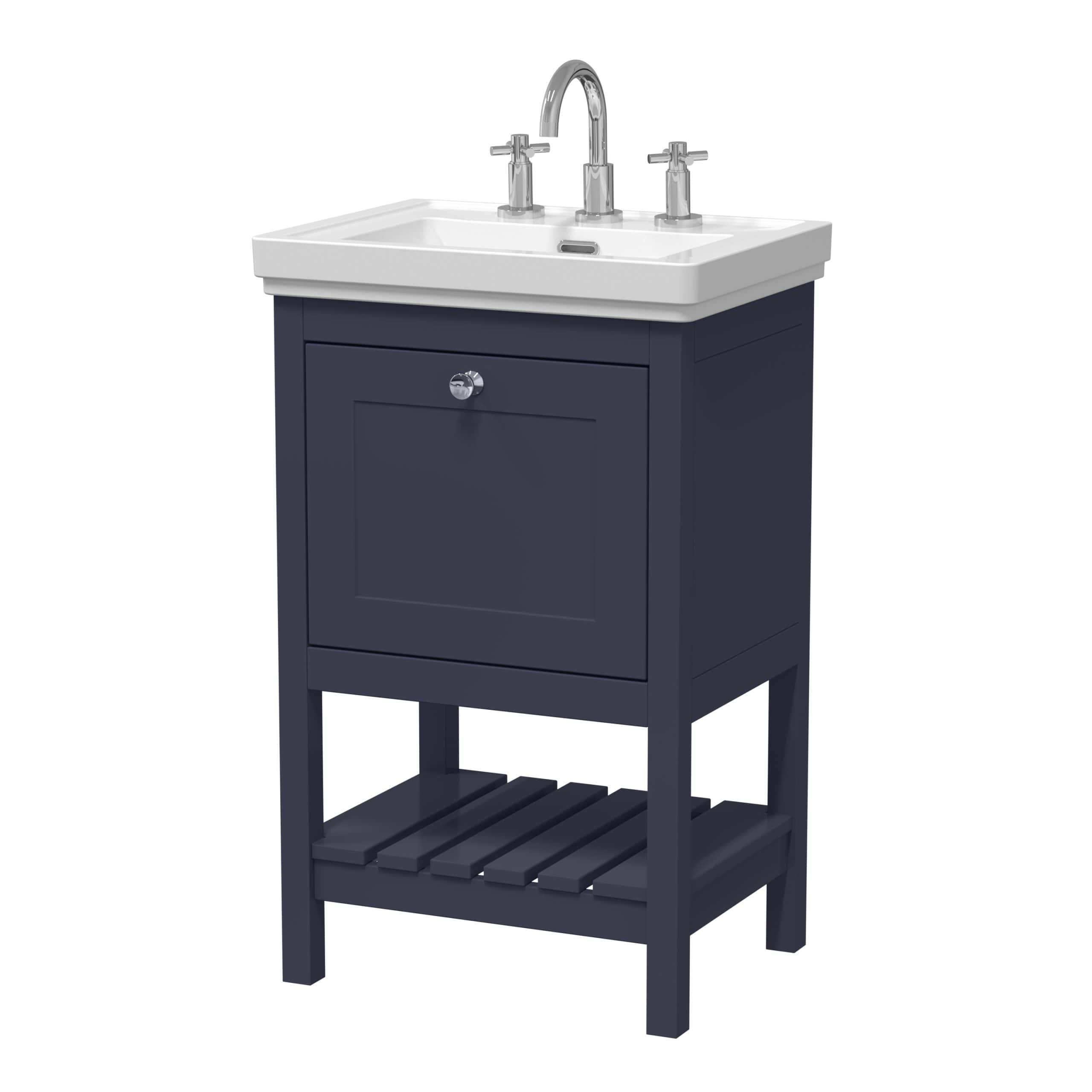 Elegant bathroom vanity with a white ceramic sink and chrome taps, featuring a navy blue cabinet and a slatted lower shelf for storage, perfect for modern bathroom interiors.