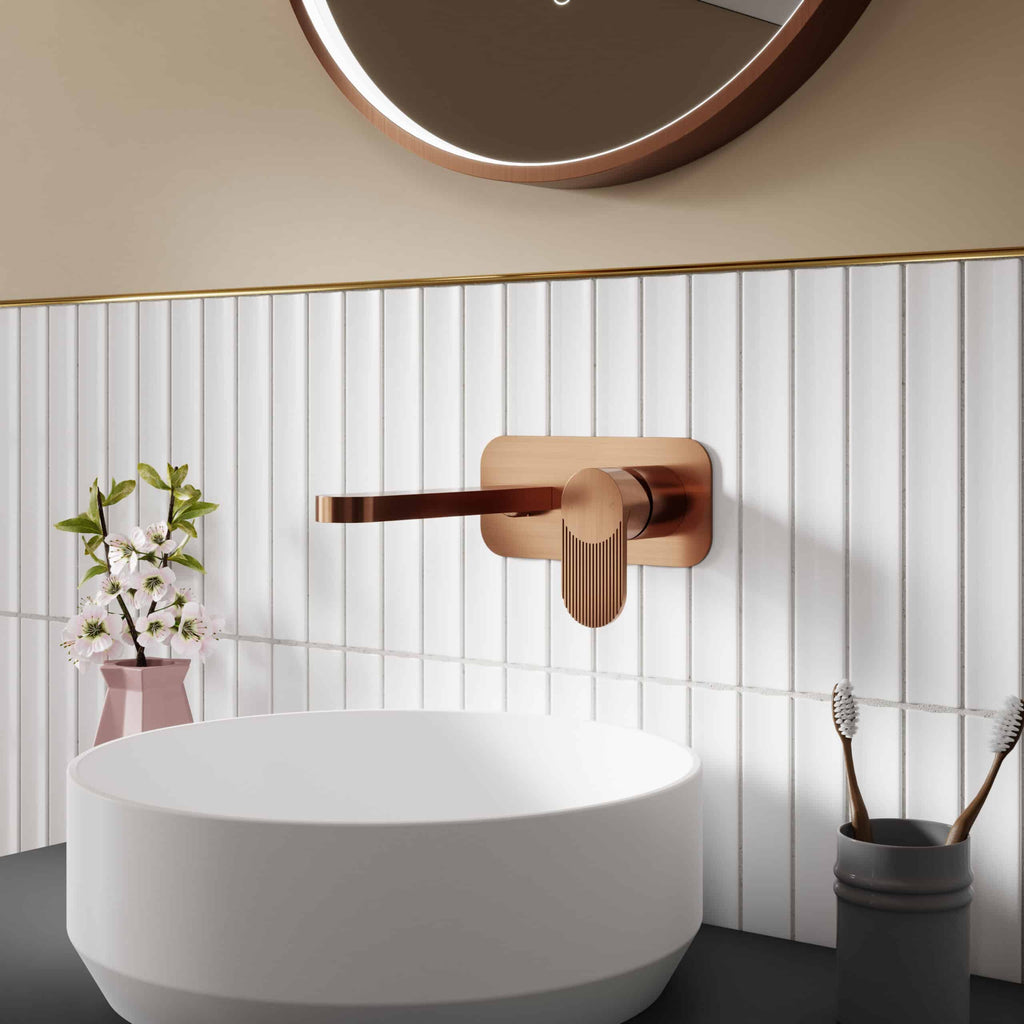 Brass bathroom mixer tap with wooden base, modern design, white oval sink, decorative flowers, toothbrush holder, minimalist bathroom decor, Bubly Bathrooms style, contemporary bathroom fixtures, high-quality bathroom accessories, premium bathroom hardware.