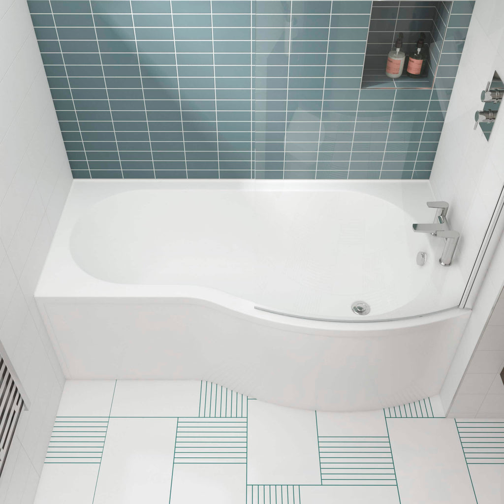 Modern white bathtub with sleek chrome fixtures in a contemporary bathroom featuring blue and white tiled walls and patterned floor tiles.