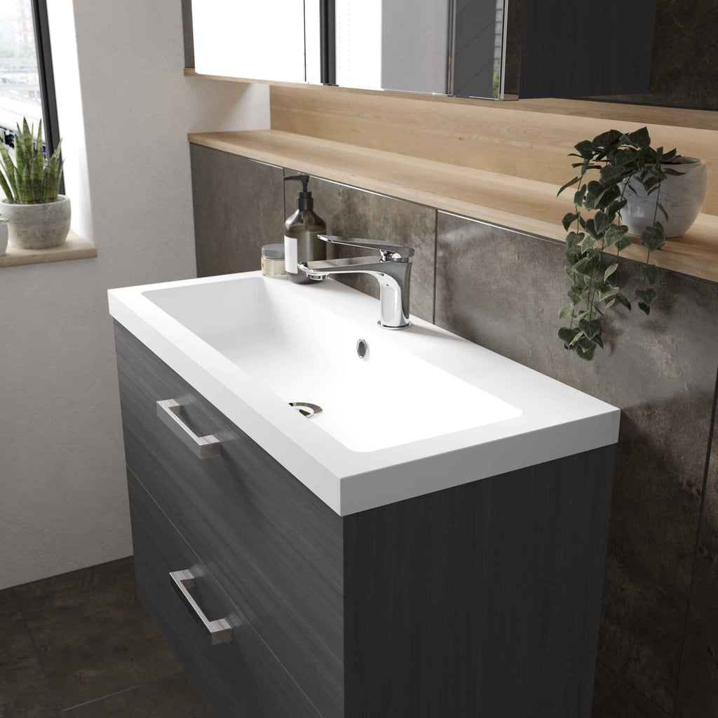 Modern bathroom vanity with white sink and chrome faucet, grey cabinet, and wooden shelf in a contemporary design, perfect for stylish bathroom upgrades.