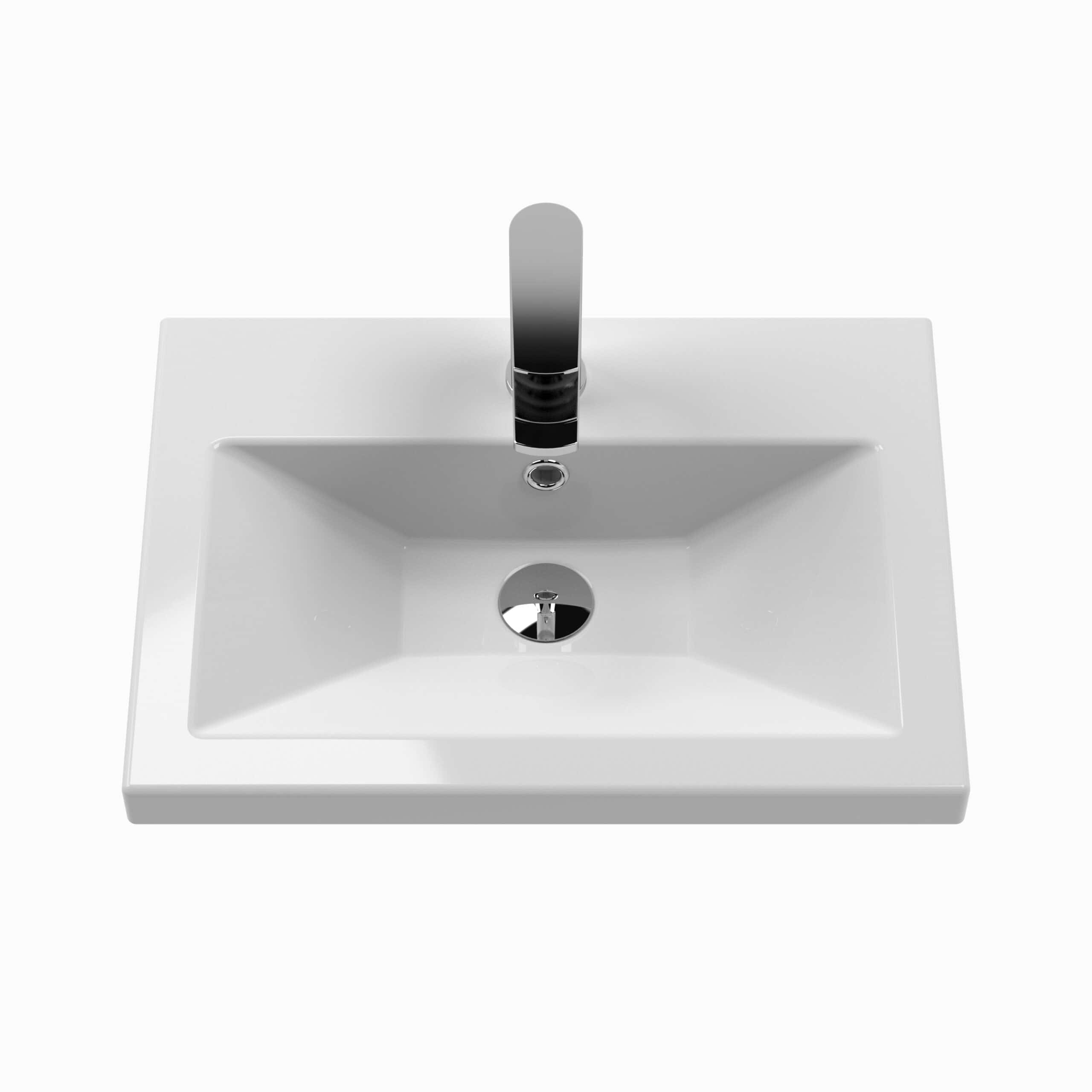 Sleek white bathroom sink with modern chrome faucet, perfect for contemporary bathroom interiors, featuring a smooth rectangular basin, easy-to-clean design, ideal for luxury bathroom upgrades.
