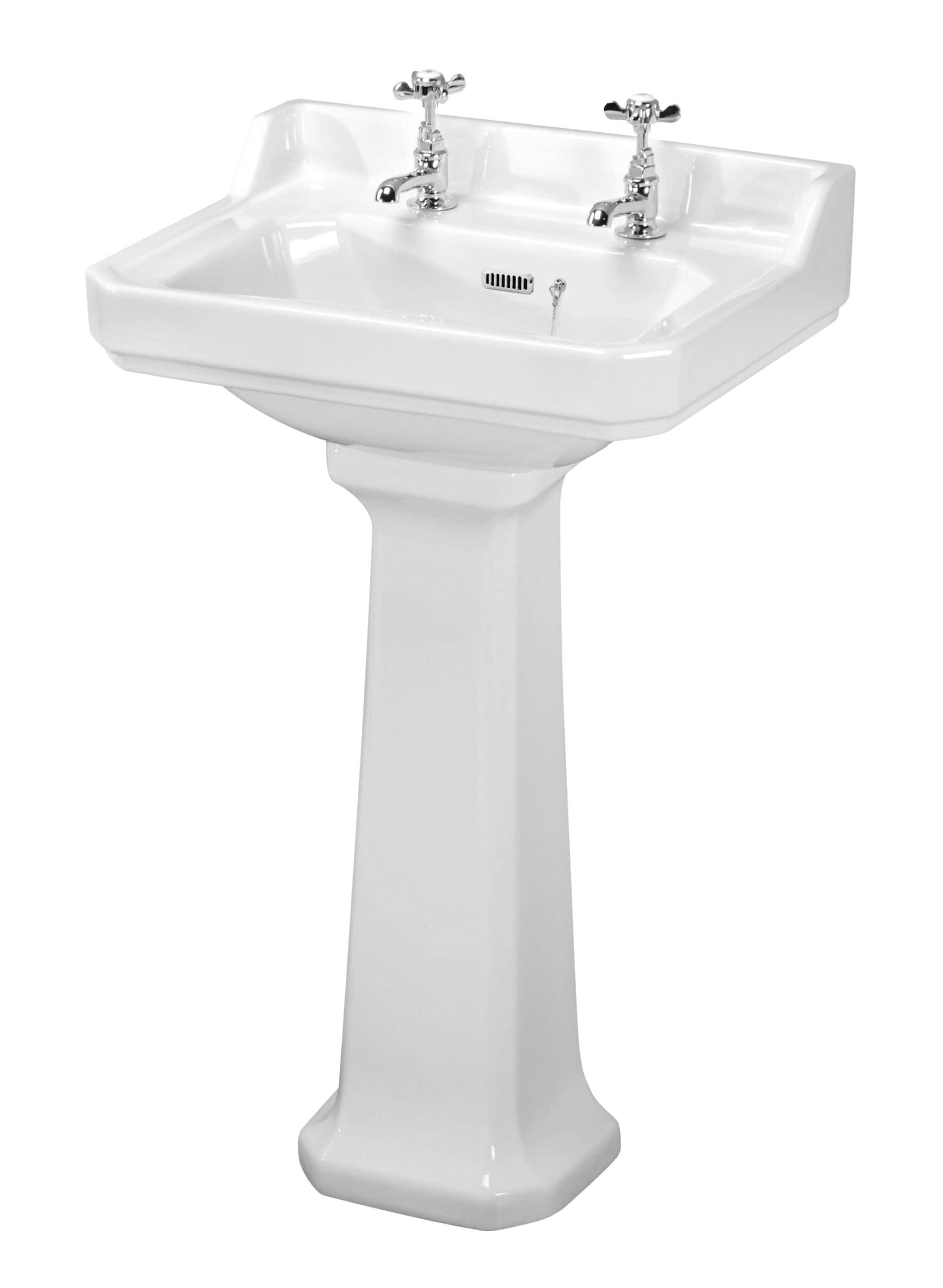 Classic white ceramic bathroom sink with dual taps and pedestal, ideal for traditional bathroom designs and complete with integrated overflow and drain features.