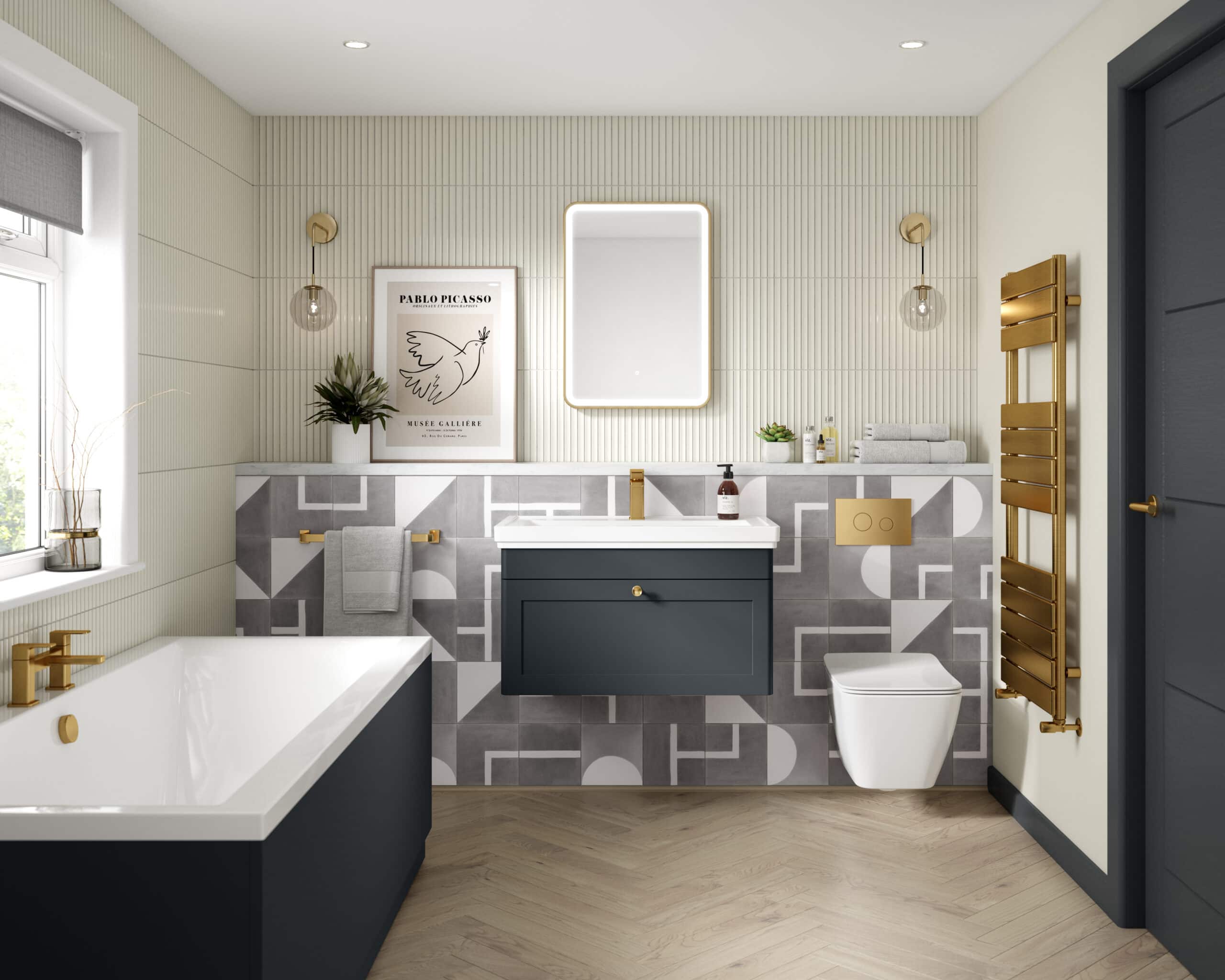 Modern bathroom with elegant navy blue and gold fixtures, white bathtub, wall-mounted toilet, stylish patterned tiles, and contemporary vanity with backlit mirror; perfect for luxury bathroom design.