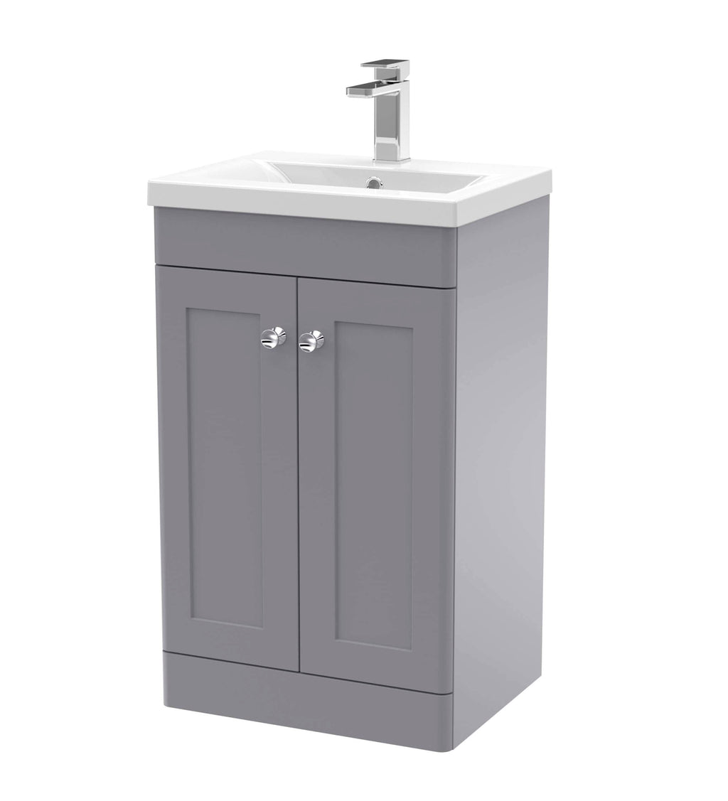 Modern grey bathroom vanity unit with integrated sink and chrome tap, perfect for contemporary bathroom vanity cabinets and storage solutions.