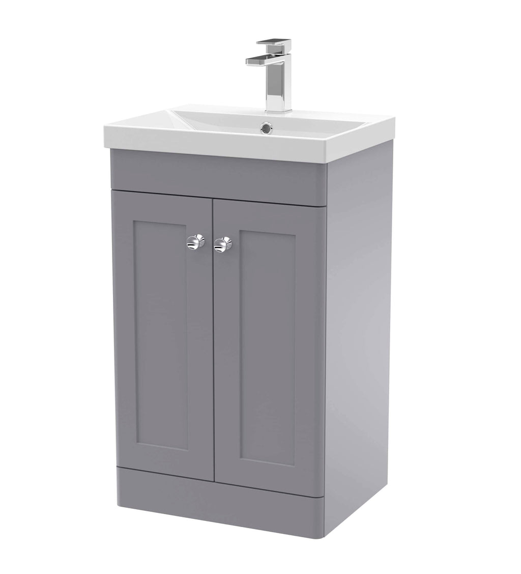 Modern grey bathroom vanity unit with integrated sink and chrome tap, ideal for contemporary bathroom interiors and space-saving storage solutions.