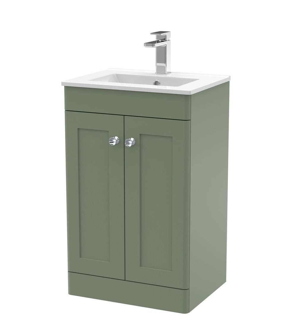 Modern green bathroom vanity with integrated sink and chrome tap fixtures, ideal for stylish bathroom renovations.