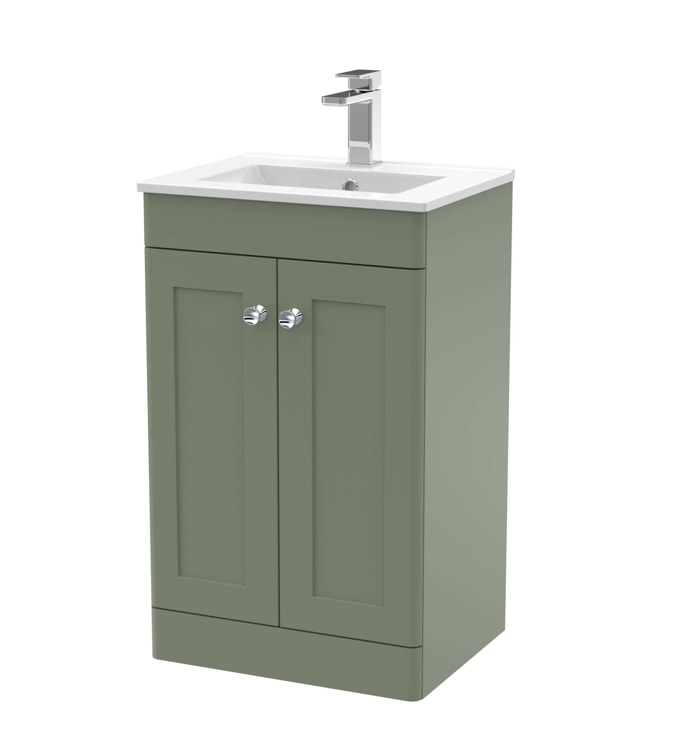 Modern green bathroom vanity with integrated sink and chrome tap fixtures, ideal for stylish bathroom renovations.
