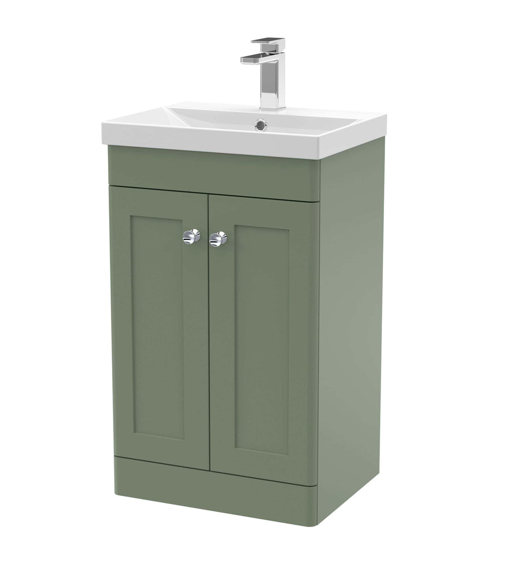 Modern bathroom vanity unit with integrated sink, green finish, and chrome handles, ideal for stylish bathroom storage and washbasin setup.