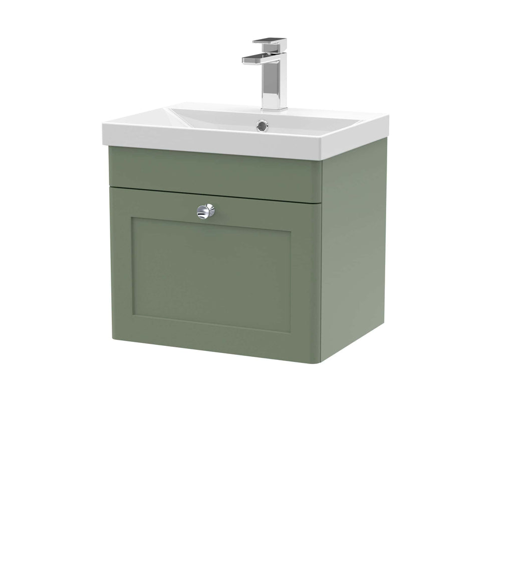 Modern bathroom vanity with integrated sink in soft green finish and chrome hardware, ideal for stylish bathroom renovation and storage.