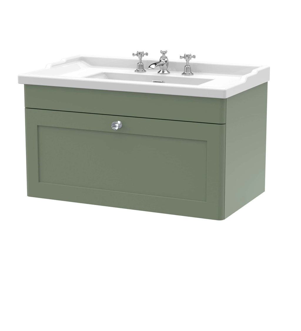 Polished bathroom vanity with sleek cabinet in sage green and white ceramic sink, featuring traditional chrome taps, ideal for modern bathroom decor.