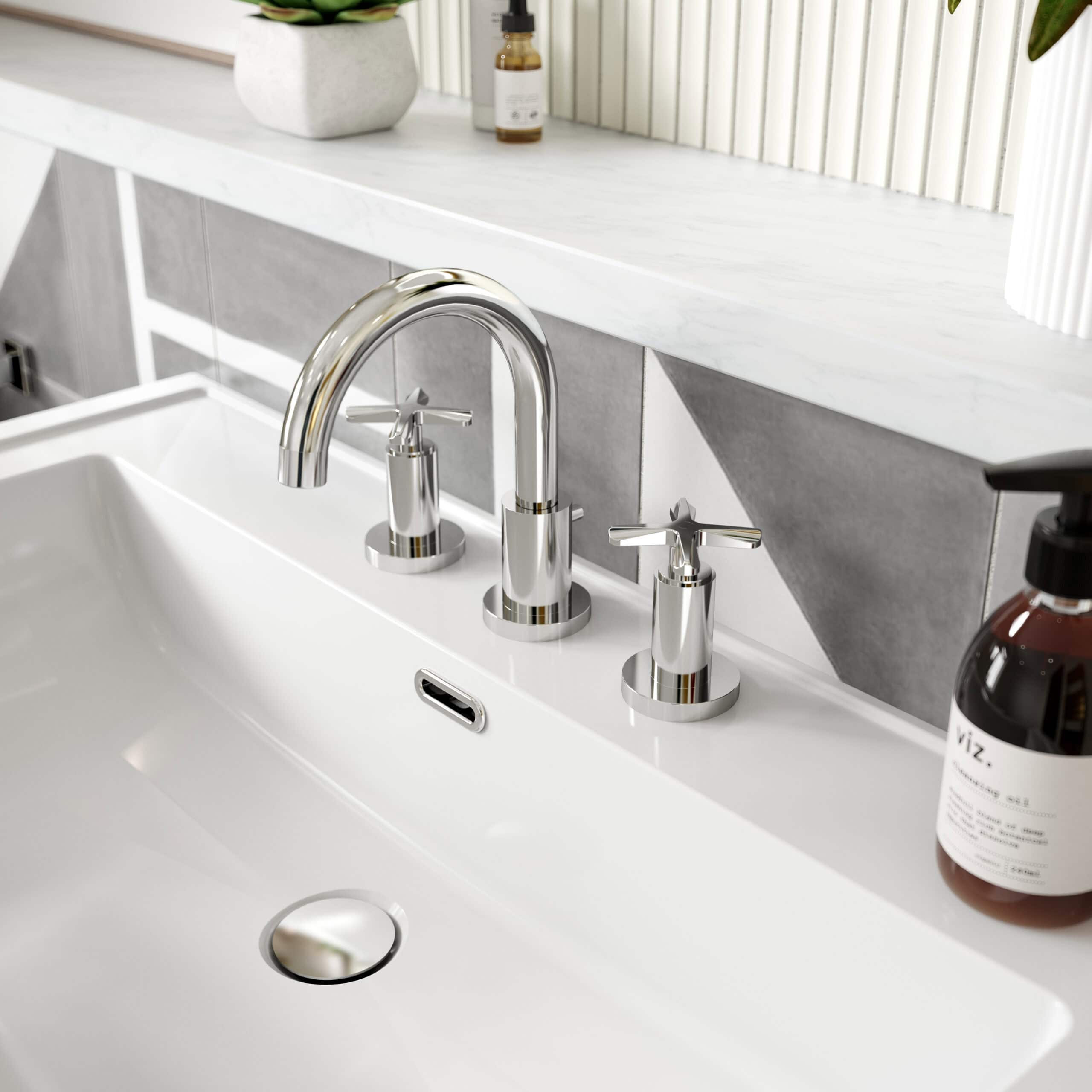 Polished chrome bathroom taps and sink with modern design, stylish grey tiled backsplash, and decorative bathroom accessories, showcasing contemporary bathroom fixtures from Bubly Bathrooms.