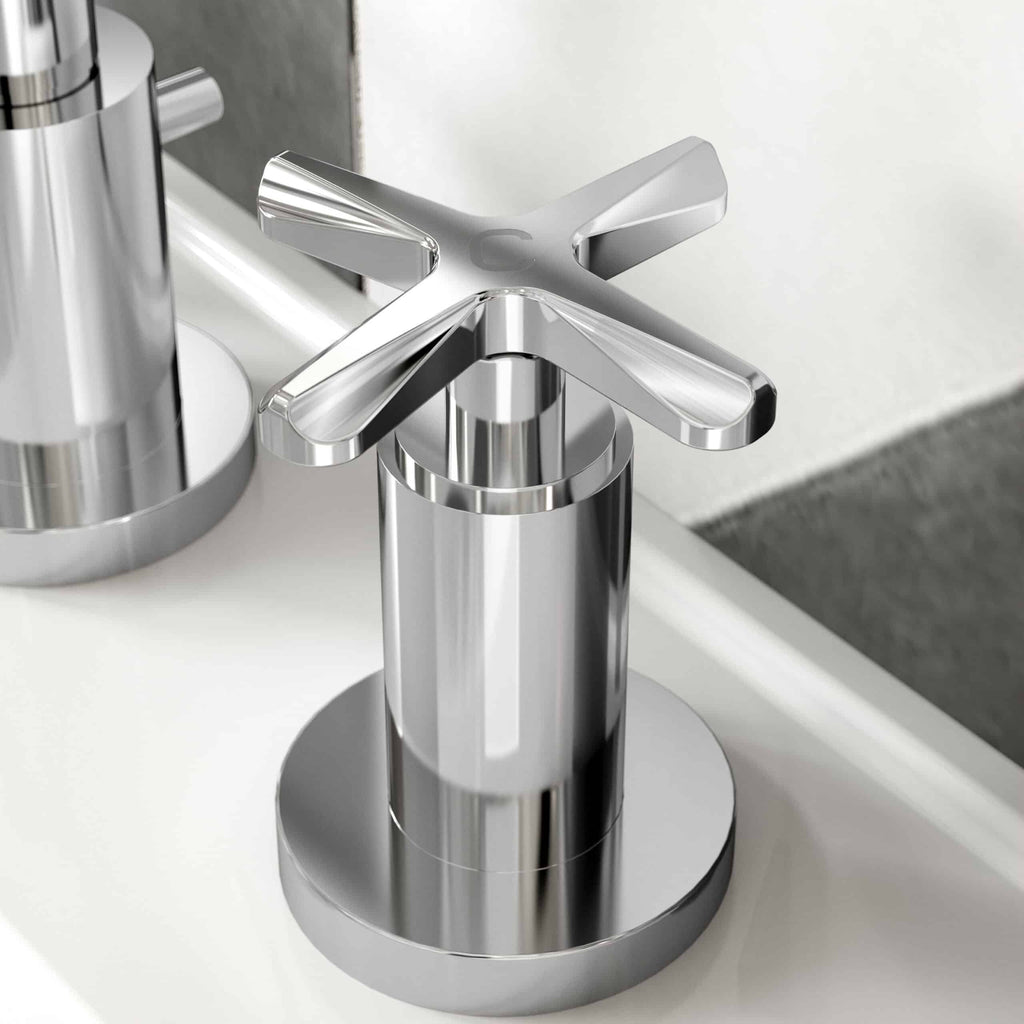 Polished chrome bathroom tap with modern cross handle features, sleek design, and durable material for stylish and functional bathroom fixtures.
