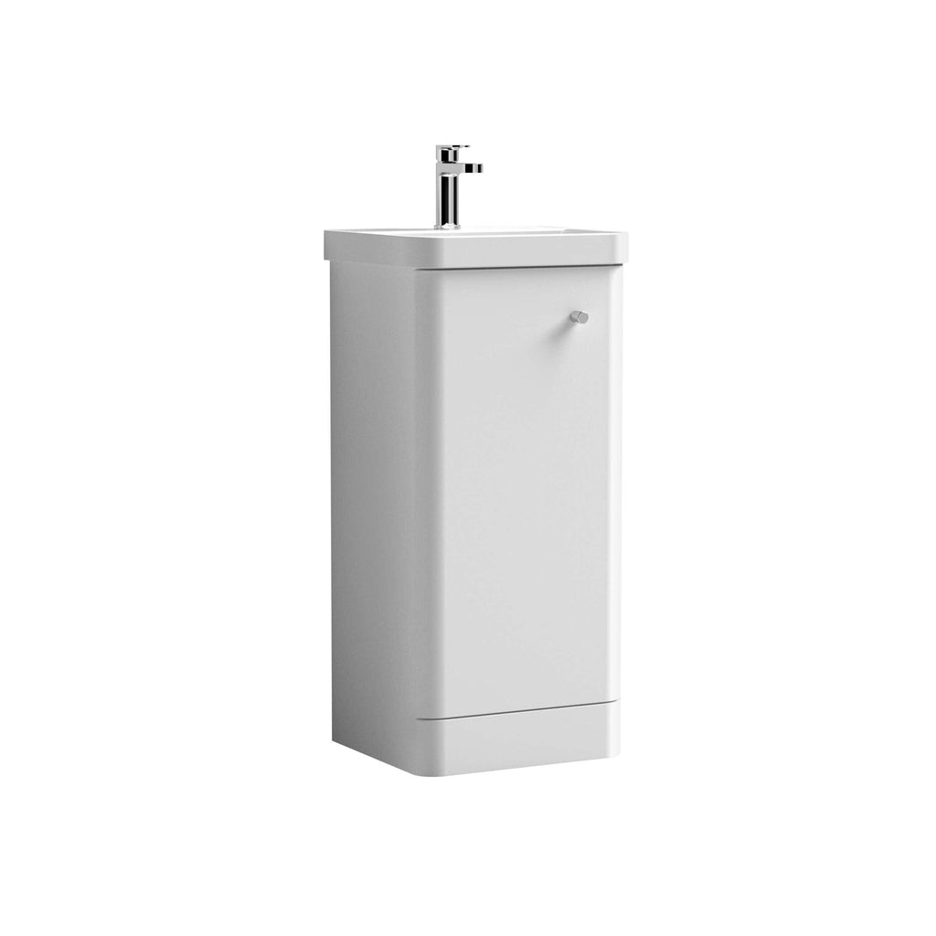 White bathroom sink with a modern chrome tap, compact stand-alone unit suitable for small bathrooms or cloakrooms. Perfect for contemporary bathroom setups.