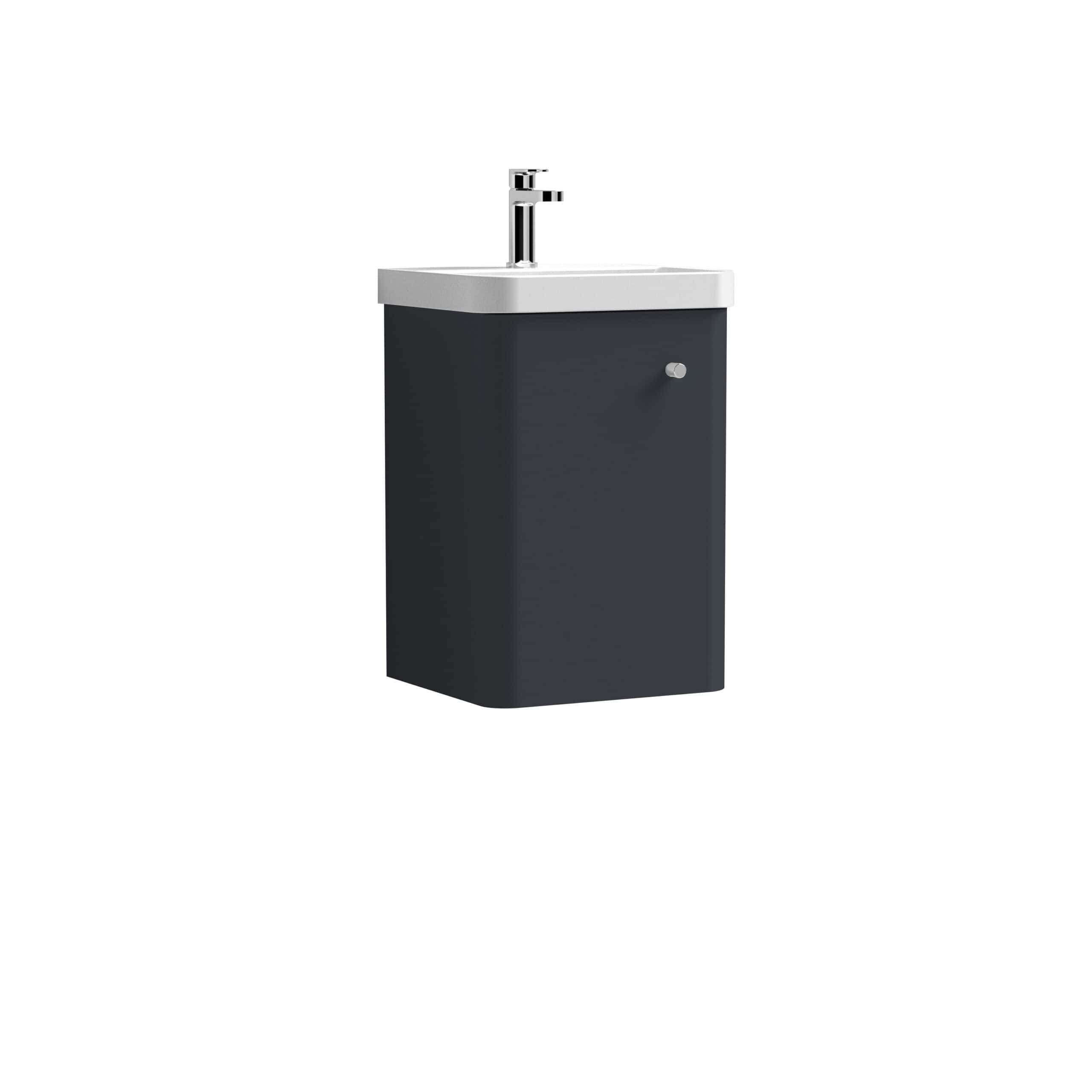 Sleek black bathroom vanity with integrated sink and modern chrome faucet, perfect for contemporary bathrooms, offering stylish storage and functional design.