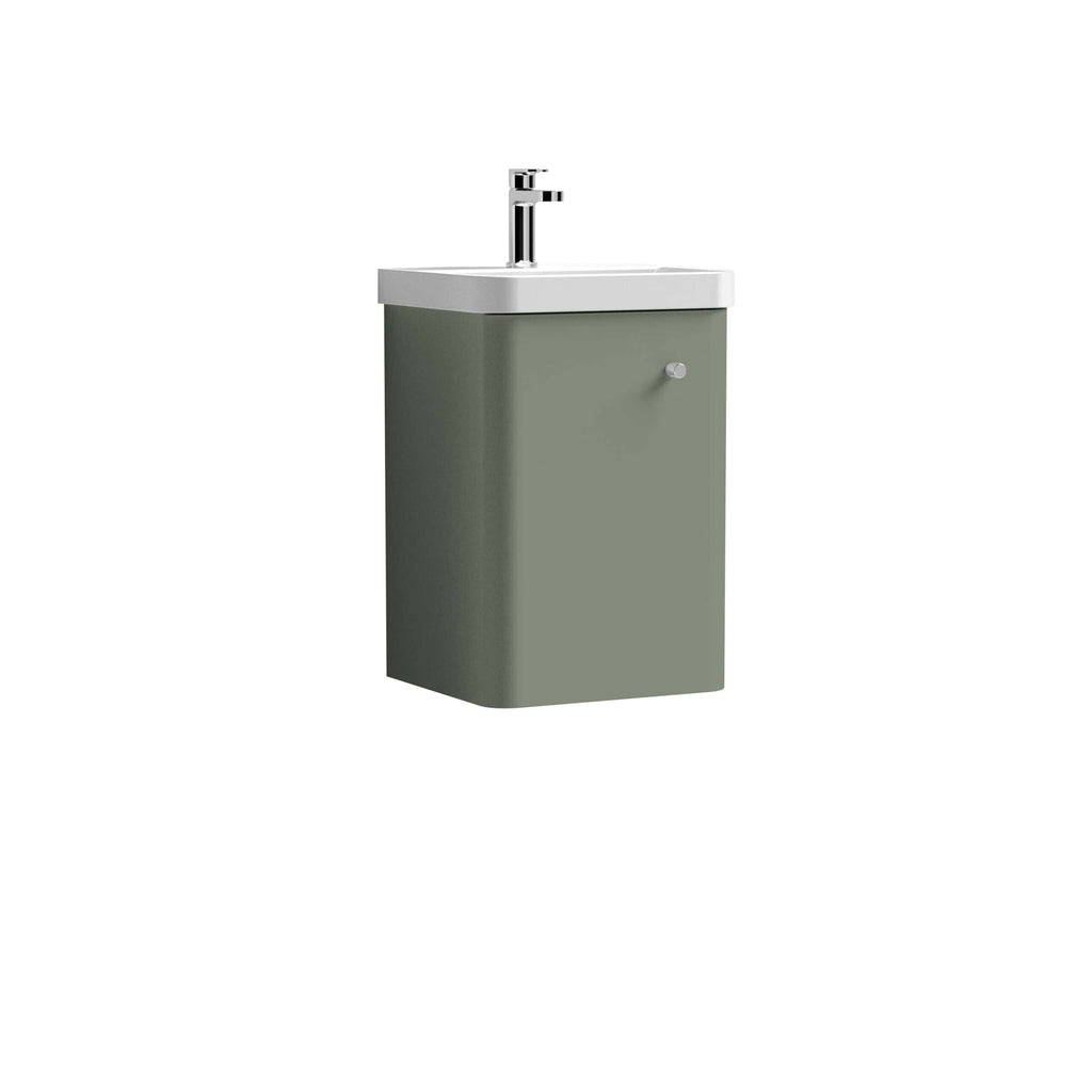 Compact bathroom sink with integrated cabinet in sage green, featuring modern design and chrome faucet for stylish bathroom decor.