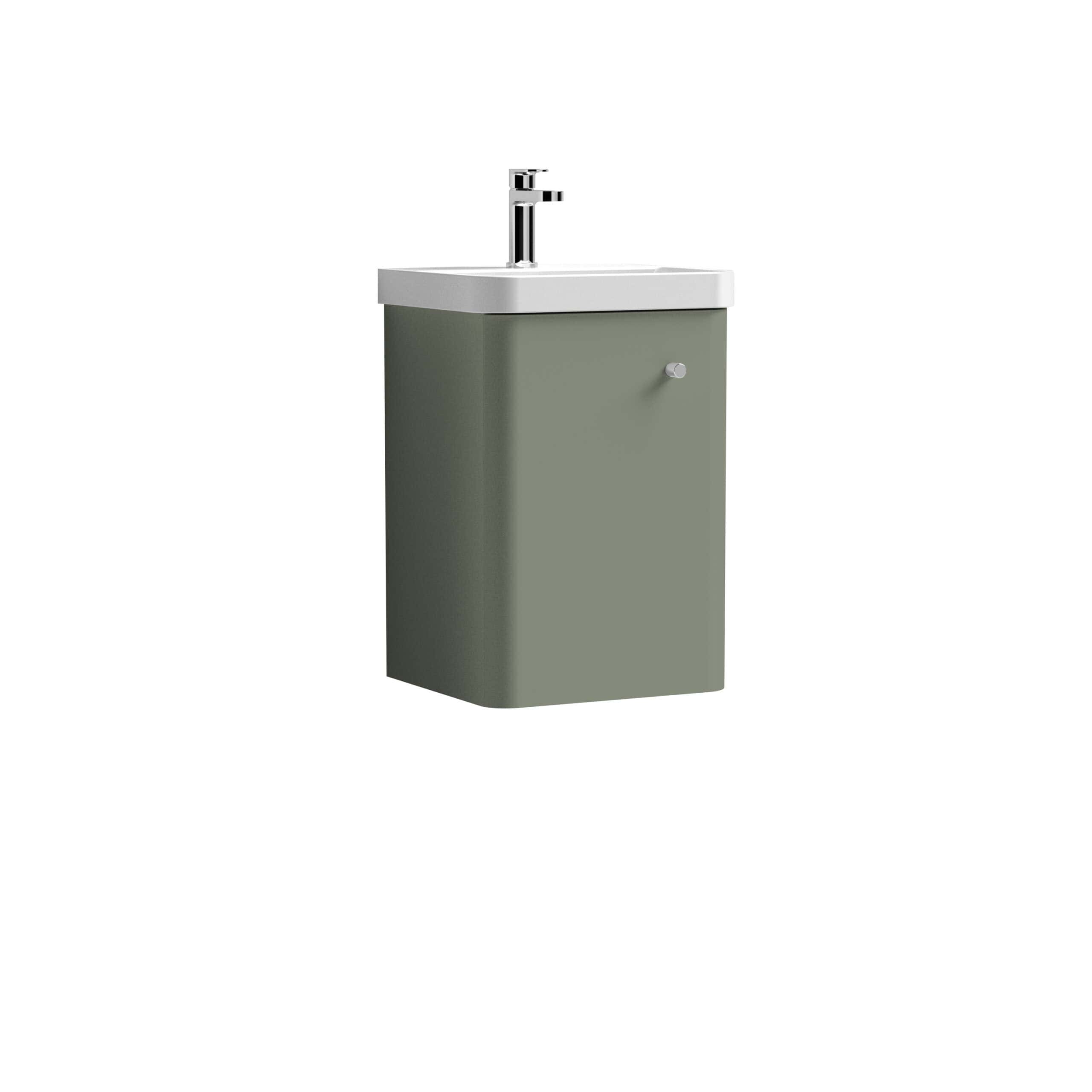 Compact bathroom sink with integrated cabinet in sage green, featuring modern design and chrome faucet for stylish bathroom decor.