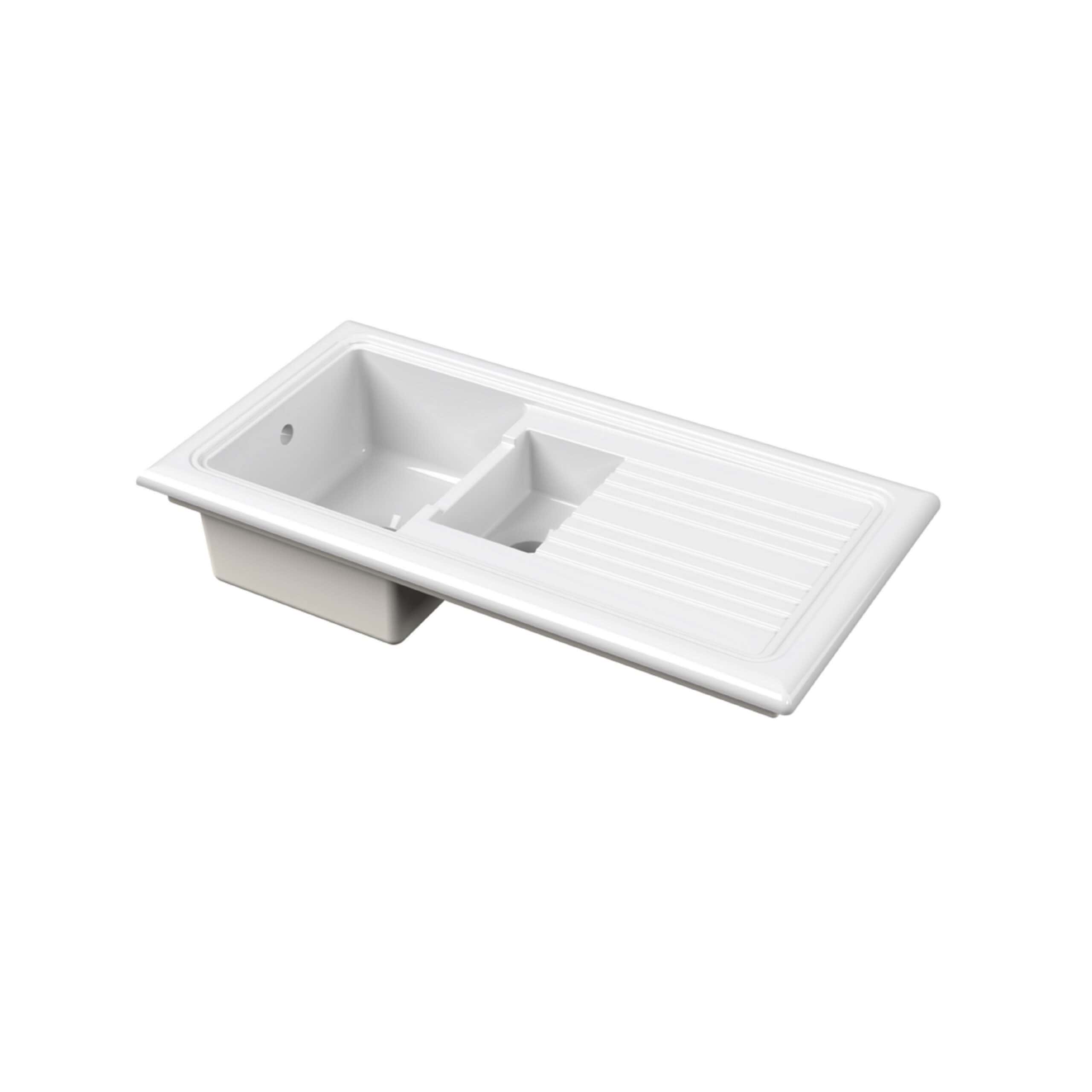 White kitchen sink with drainer and integrated basin, designed for modern bathroom or kitchen use, featuring durable ceramic construction and versatile functionality.