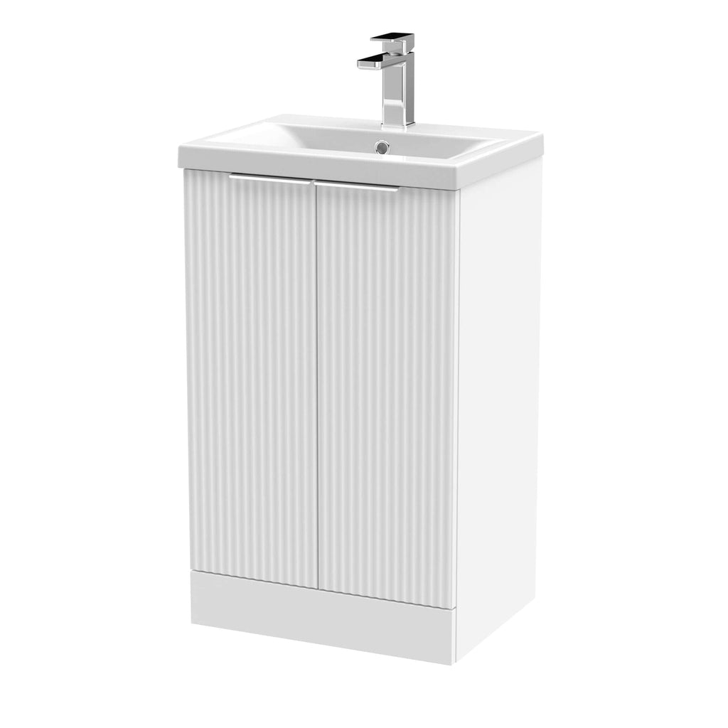 Modern white bathroom vanity with a built-in ceramic sink and sleek chrome faucet, ideal for contemporary bathroom designs and efficient space use.