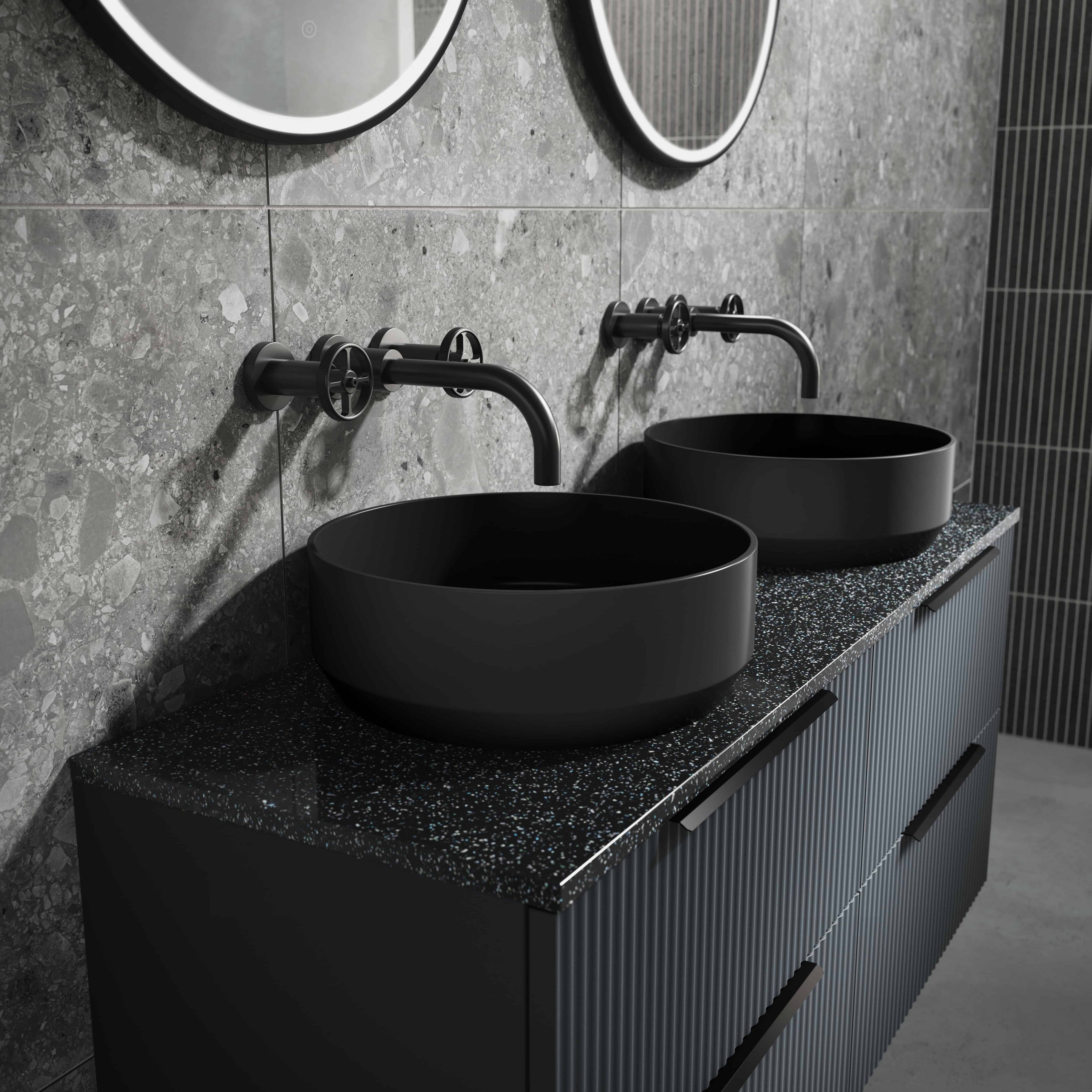 Sleek black vessel sinks with modern matte black faucets in a contemporary bathroom setting. Designed for style and functionality, perfect for modern bathroom renovations and luxury washroom design.